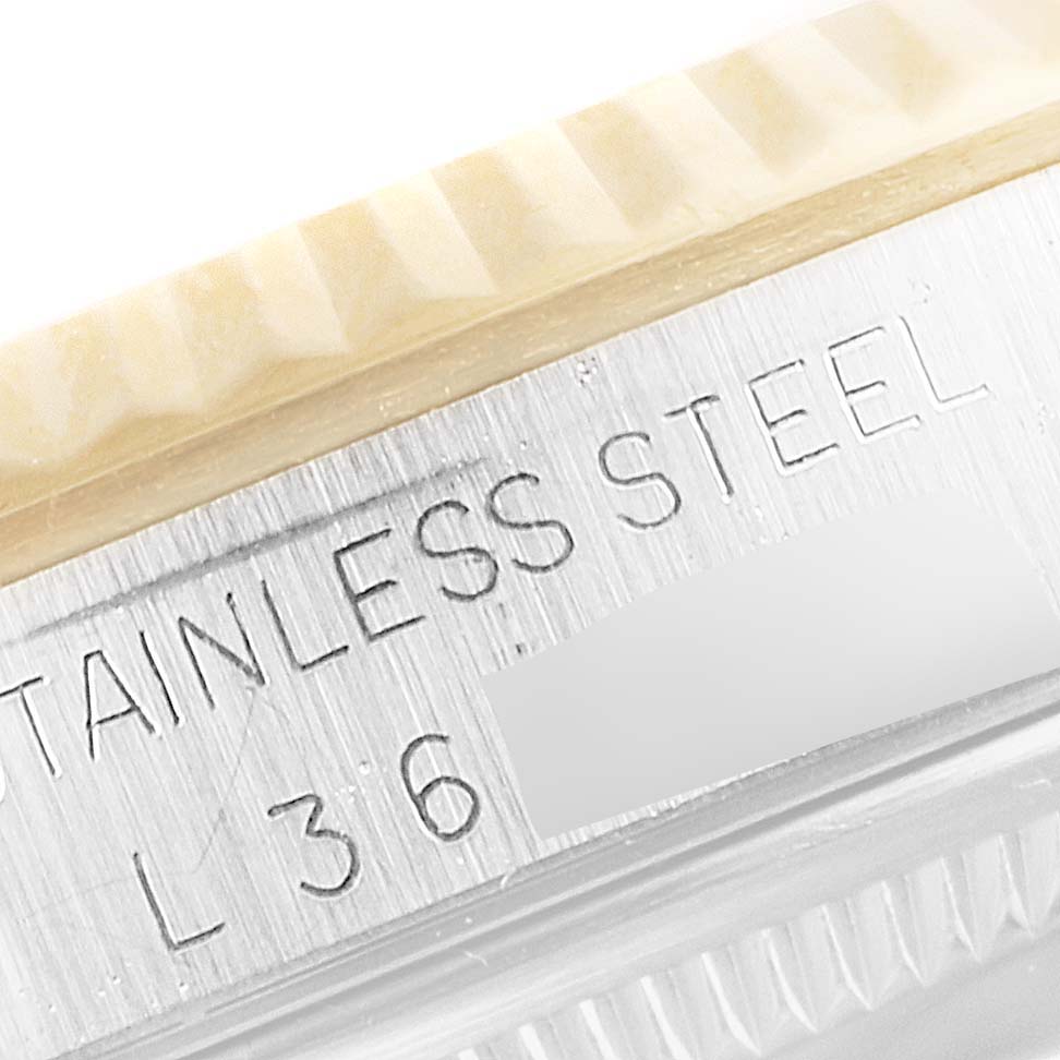 The image shows a close-up of the stainless steel bezel and case part of a Rolex Datejust 16233 Men's Steel and Gold (two tone) Champagne Dial 16233 Men's Steel and Gold (two tone) Champagne Dial model watch.