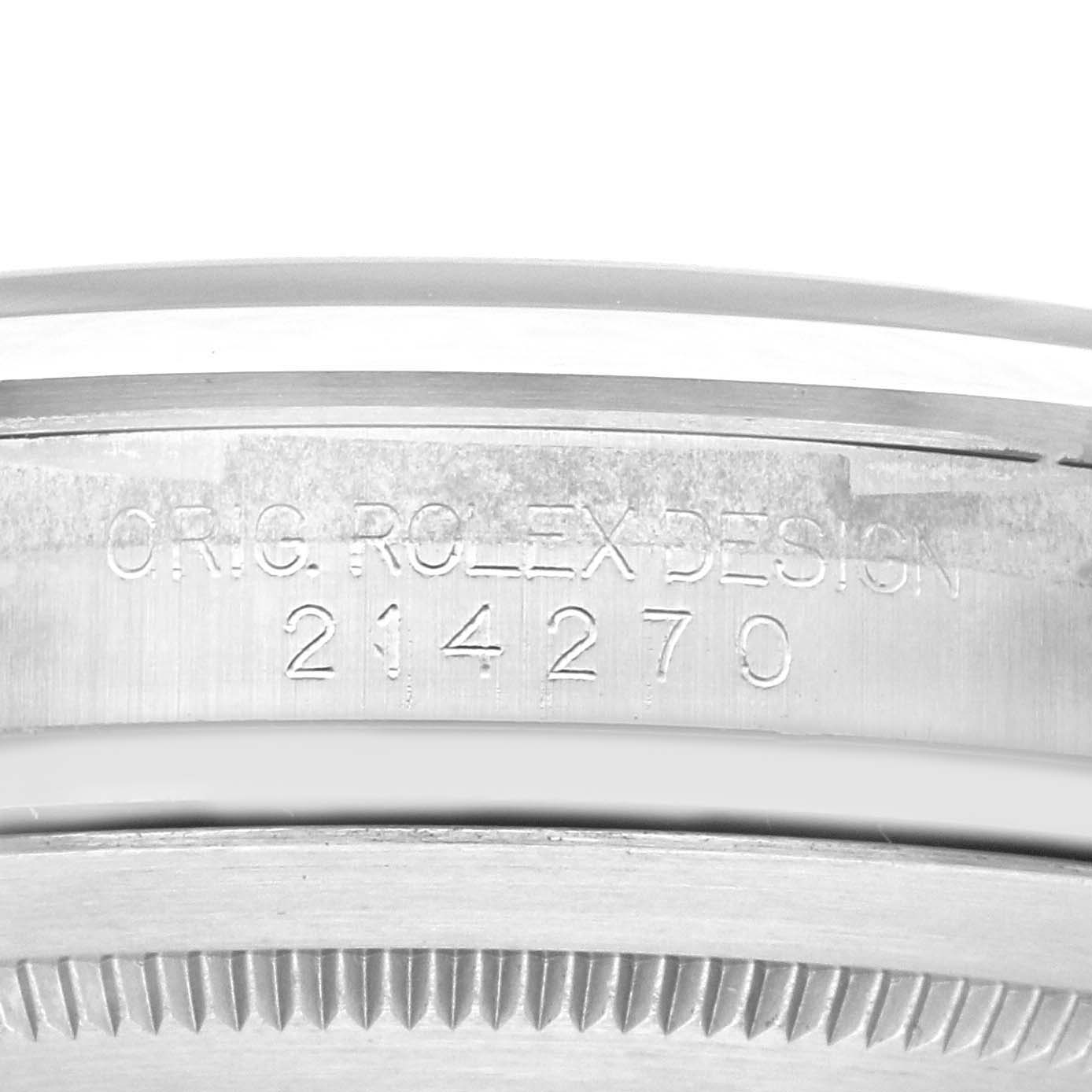 The image shows the engraved side of a Rolex Explorer 214270 Men
s Stainless Steel Black Dial 214270 Men
s Stainless Steel Black Dial watch case, featuring the model number 214270.
