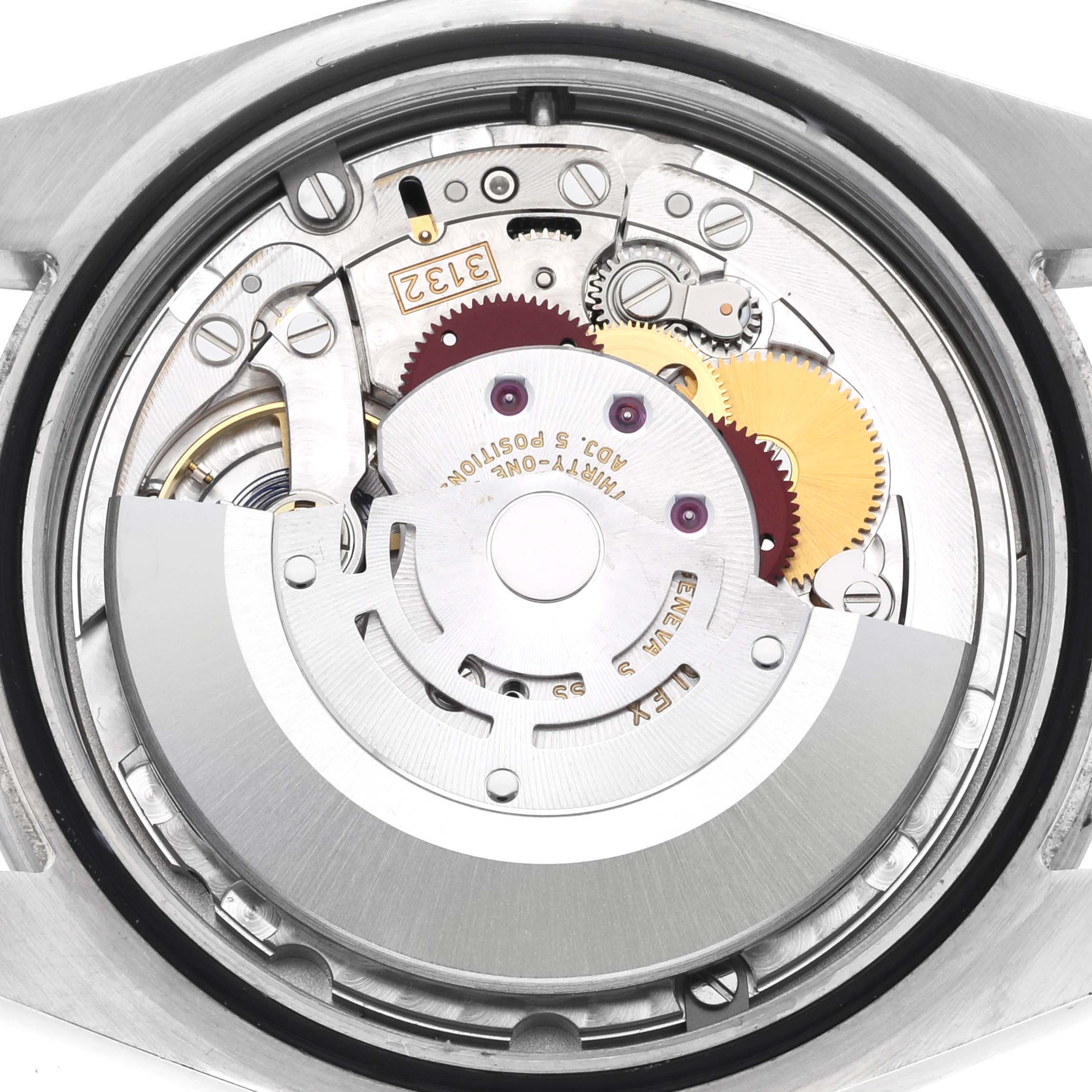The image shows the internal mechanism of a Rolex Explorer 214270 Men
s Stainless Steel Black Dial 214270 Men
s Stainless Steel Black Dial, viewed from the back, highlighting gears and movement components.