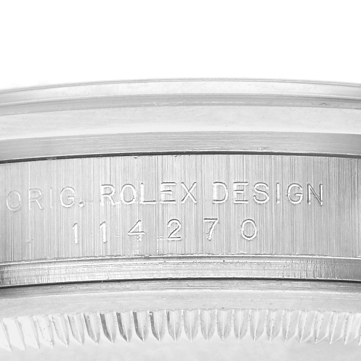 The image shows a close-up of the case side of a Rolex Explorer 114270 Men's Stainless Steel Black Dial 114270 Men's Stainless Steel Black Dial, highlighting the engraved design and model number.