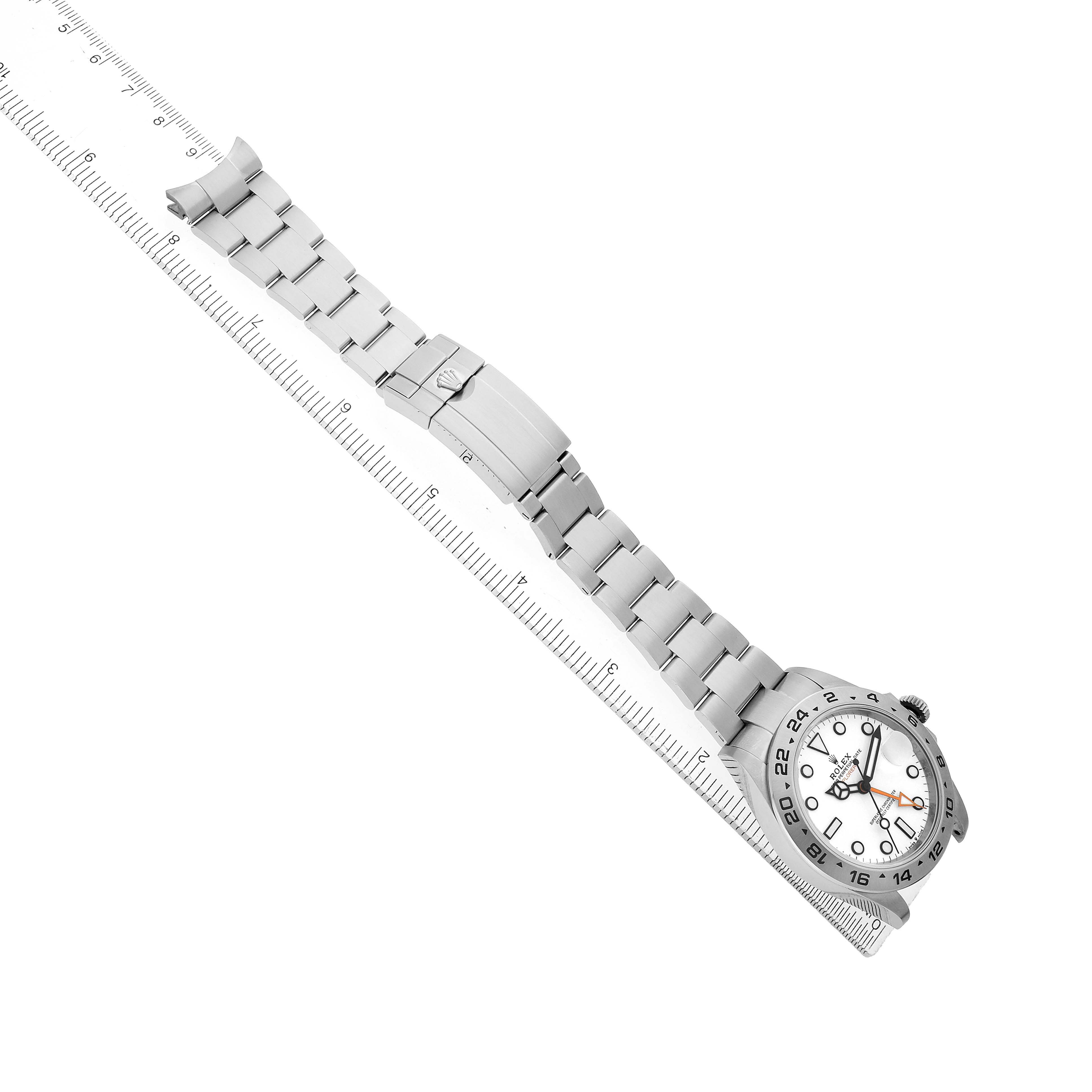 The Rolex Explorer 226570 Men's Stainless Steel White Dial watch is shown at an angled top view, featuring the case, bezel, dial, bracelet, and clasp.