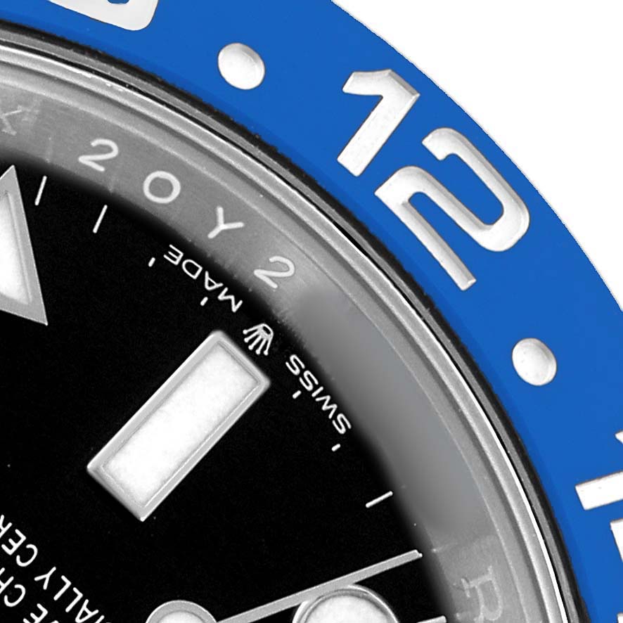 The image shows a close-up of the Rolex GMT-Master 126710BLNR Men's Stainless Steel Black Dial watch, focusing on the bezel, dial, and markers.