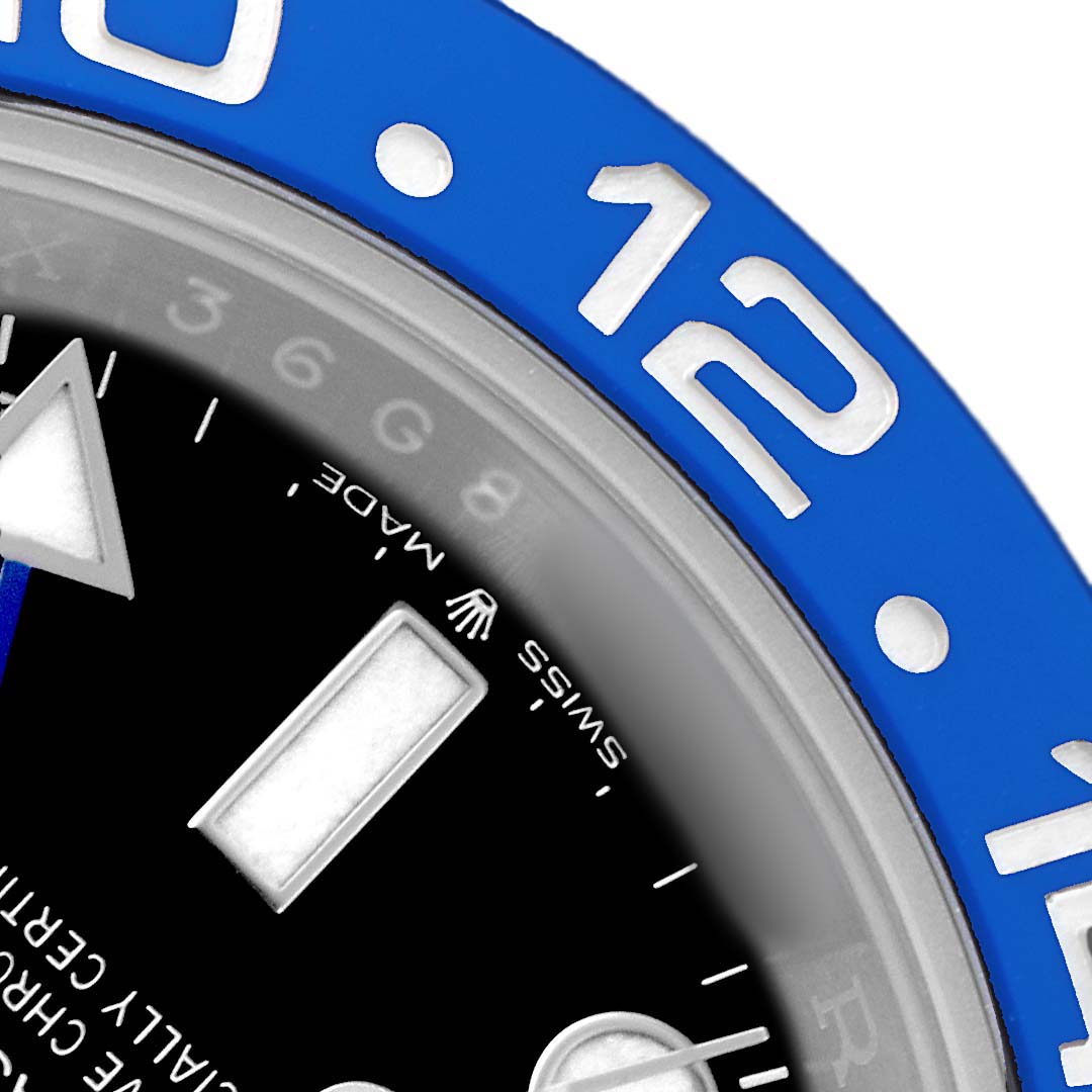 The image shows a close-up of the Rolex GMT-Master 126710BLNR Men's Stainless Steel Black Dial's bezel and part of the dial, featuring numbers and hour markers.