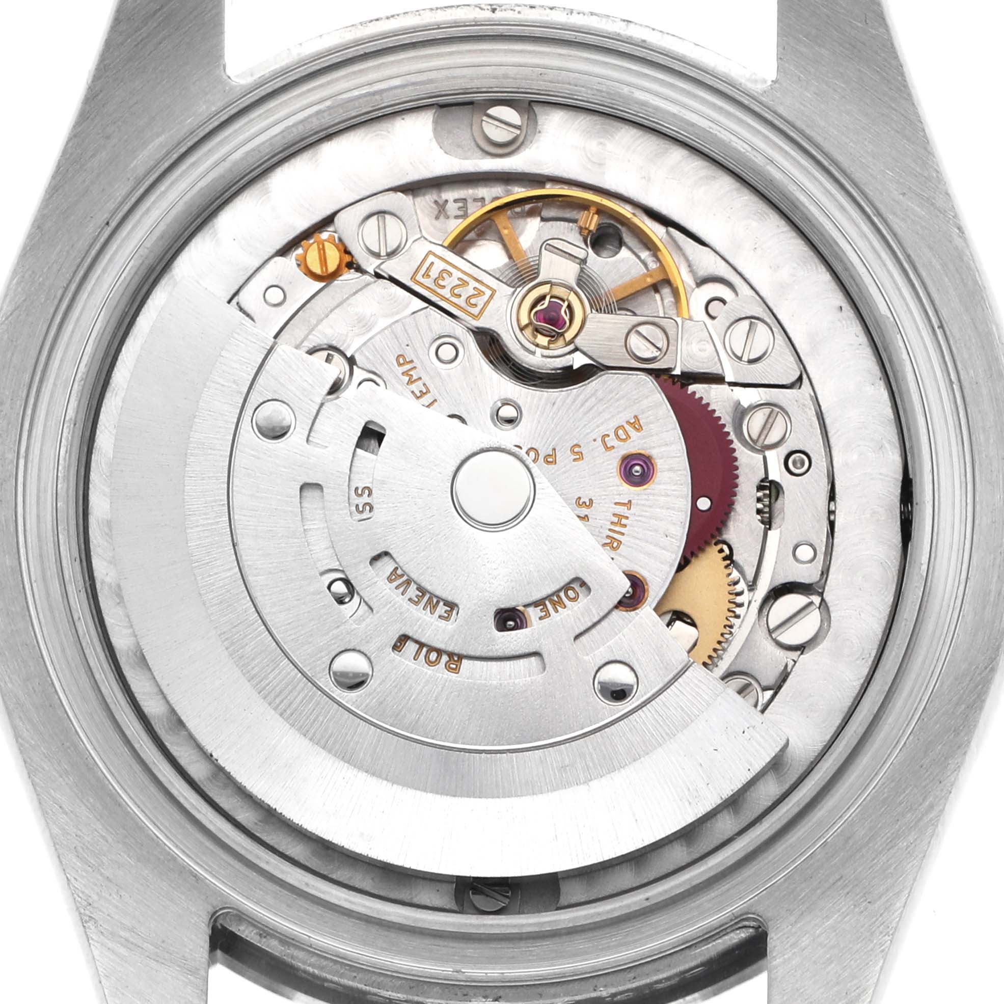 This image shows the movement of a Rolex Mid-Size 177200 Women's Stainless Steel Silver Dial watch, viewed from the back, highlighting its intricate gears and components.