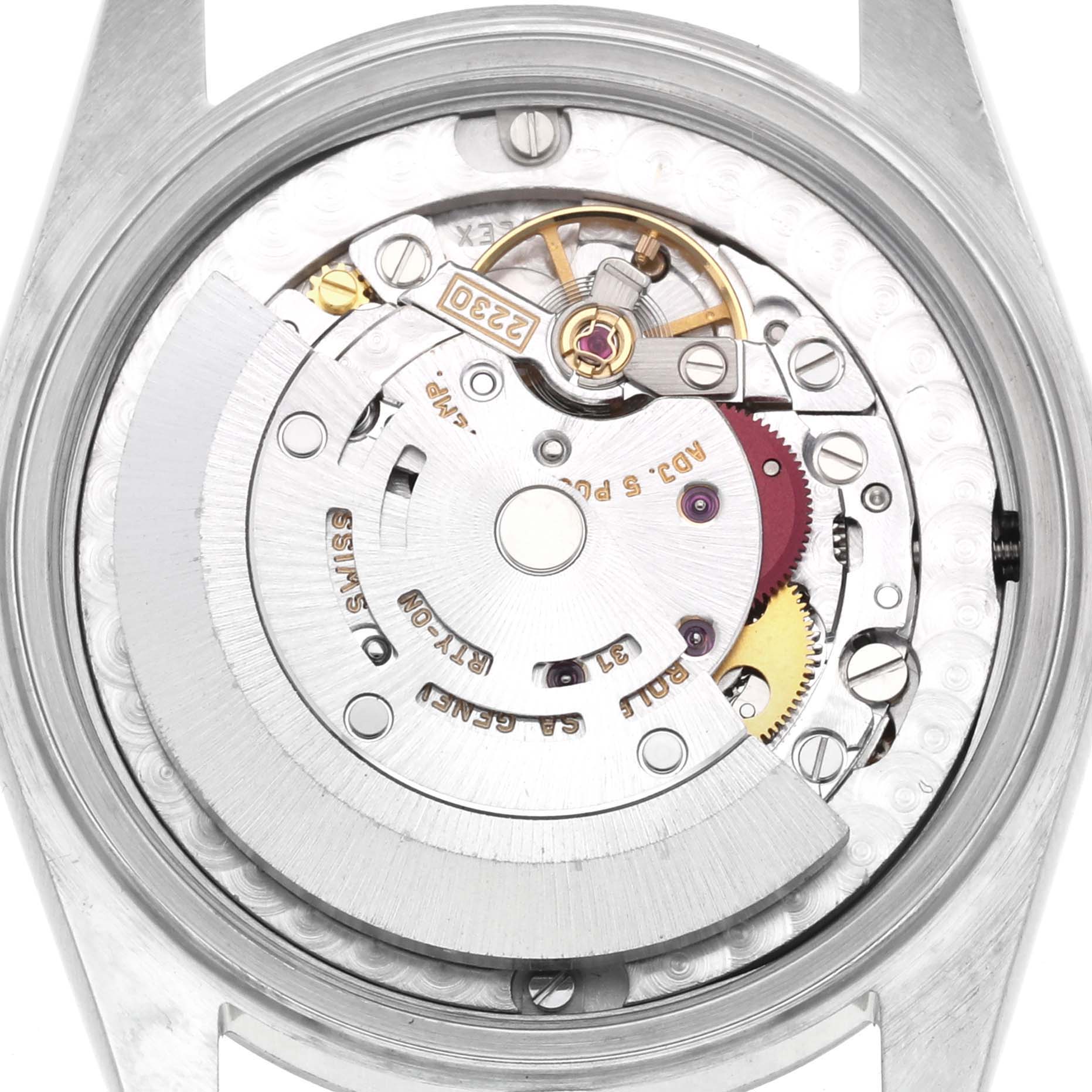 The image shows the back view of a Rolex Oyster Perpetual 77080 Women's Stainless Steel Blue Dial, displaying its internal movement and rotor.