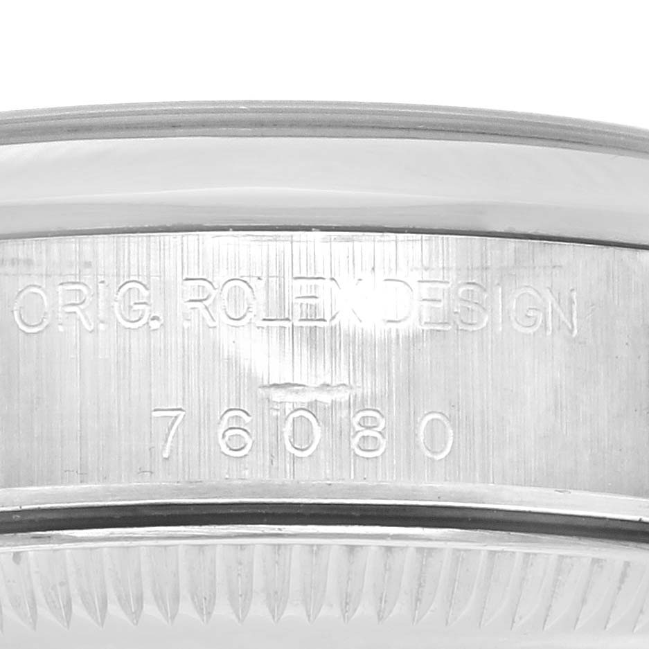 The image shows a side view of the bezel with "ORIG. ROLEX DESIGN" and model number for the Rolex Oyster Perpetual 76080 Women's Stainless Steel Pink Dial 76080 Women's Stainless Steel Pink Dial.