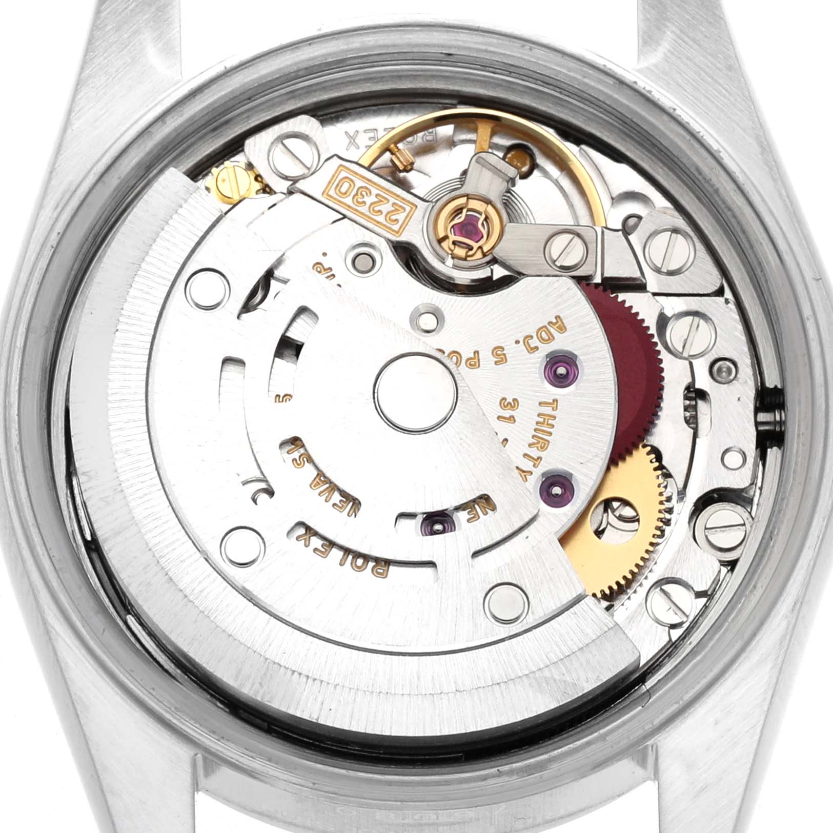 The image shows the internal mechanism of a Rolex Oyster Perpetual 76080 Women's Stainless Steel Blue Dial watch from a top view, highlighting gears and various components.