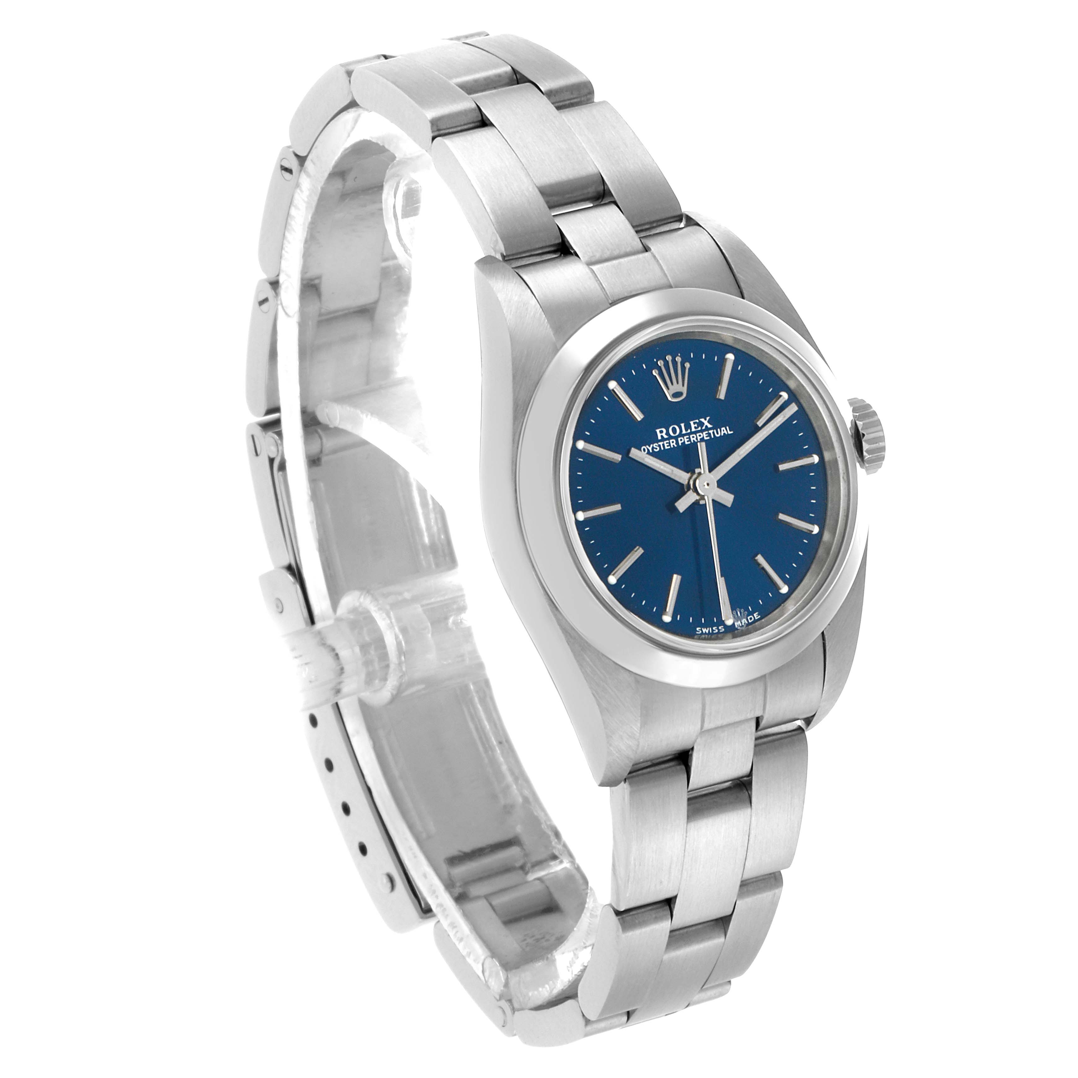 The Rolex Oyster Perpetual 76080 Women's Stainless Steel Blue Dial watch is shown at a three-quarter angle, displaying the dial, bezel, bracelet, and crown.