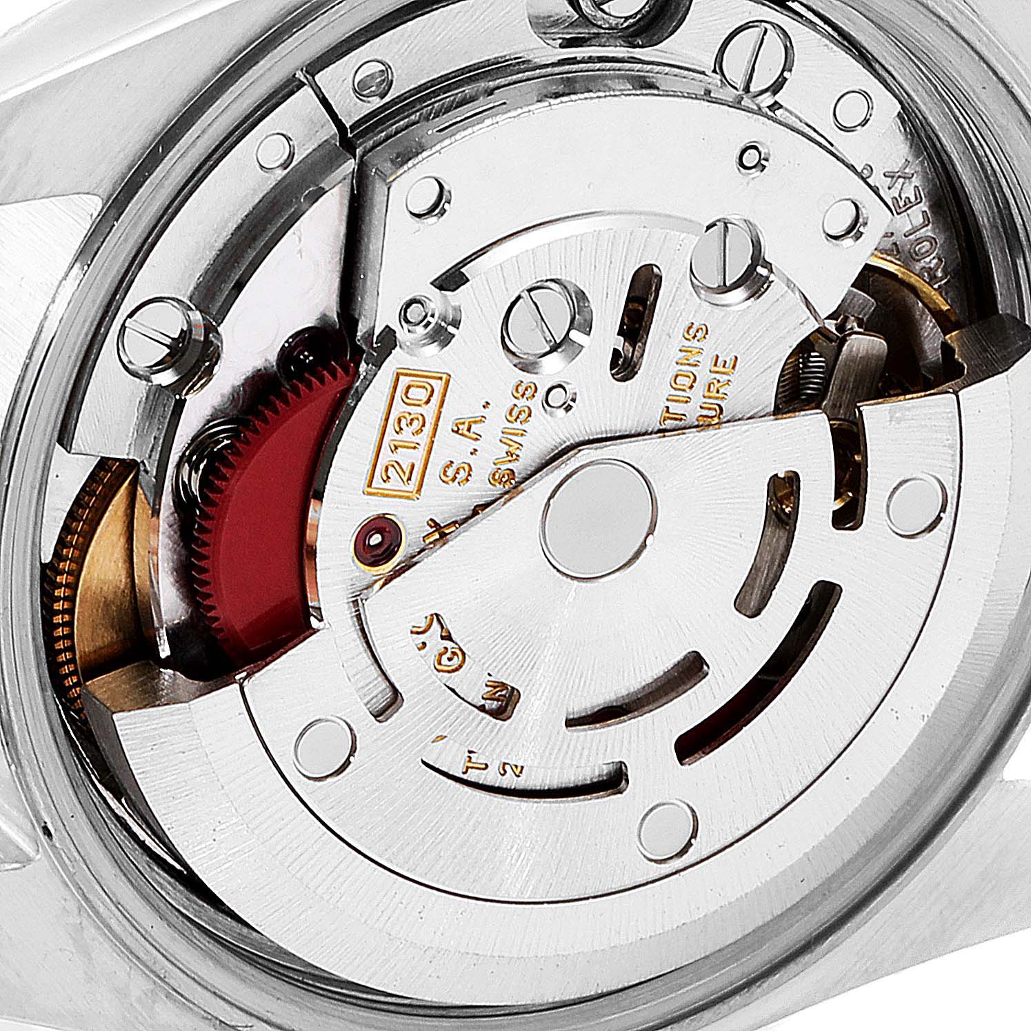 This is a close-up view of the movement mechanism of a Rolex Oyster Perpetual 67193 Women's Steel and Gold (two tone) Champagne Dial 67193 Women's Steel and Gold (two tone) Champagne Dial watch, showcasing its intricate components.