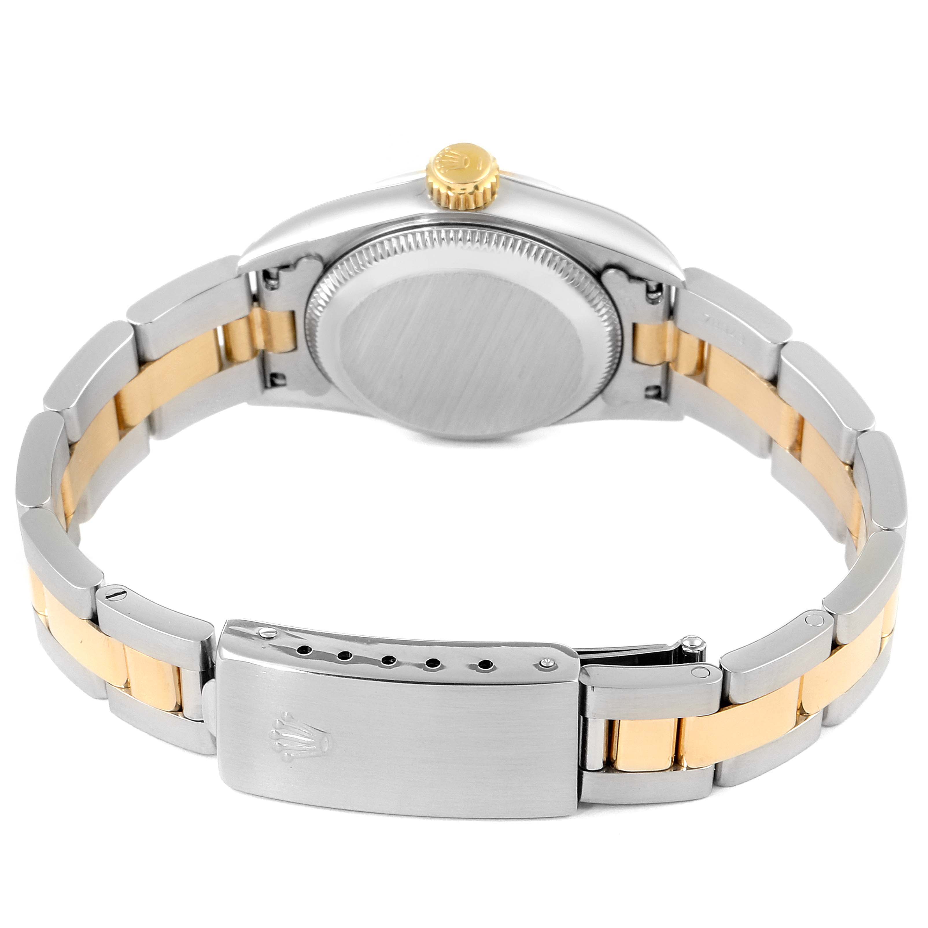 This image shows the back view of the Rolex Oyster Perpetual 67193 Women's Steel and Gold (two tone) Champagne Dial 67193 Women's Steel and Gold (two tone) Champagne Dial watch, highlighting the case back, crown, and bracelet with a clasp.