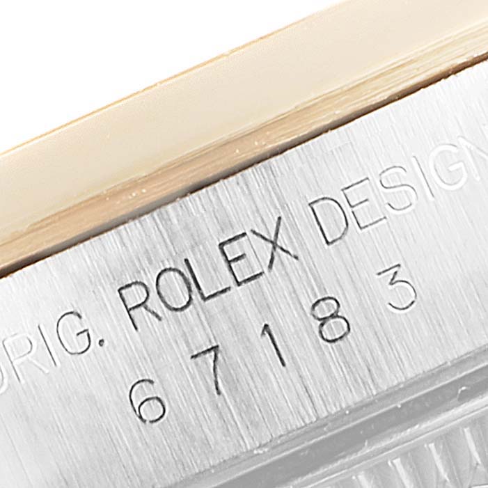The close-up image shows the engravings on the case side of a Rolex Oyster Perpetual 67183 Women
s Steel and Gold (two tone) White Dial 67183 Women
s Steel and Gold (two tone) White Dial watch.
