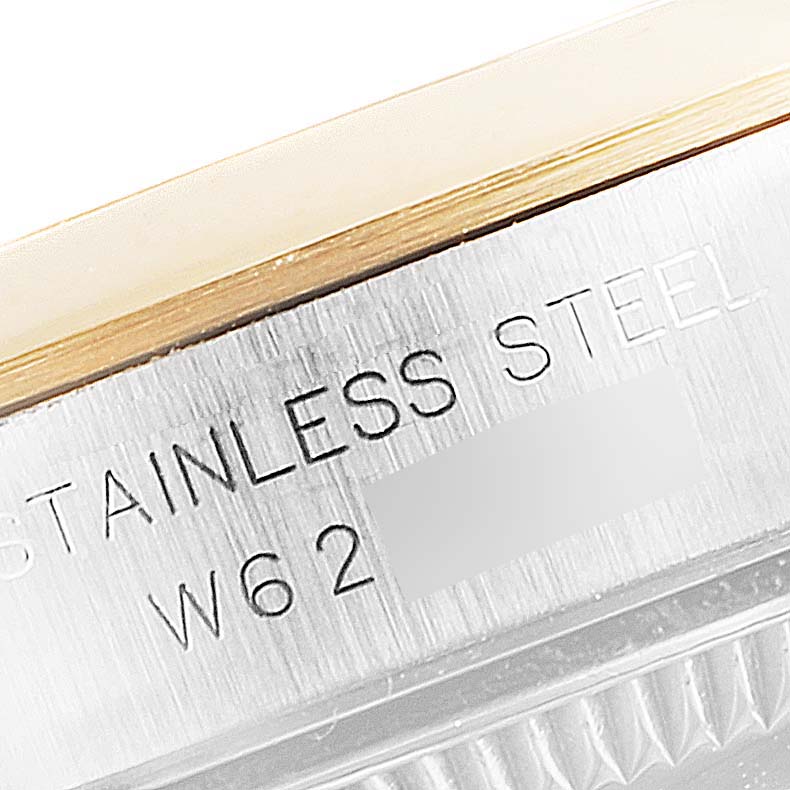 This close-up image shows the stainless steel part and engravings on a Rolex Oyster Perpetual 67183 Women
s Steel and Gold (two tone) White Dial 67183 Women
s Steel and Gold (two tone) White Dial watch.