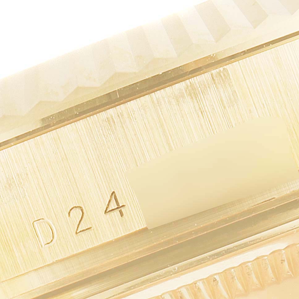 This close-up image shows the side engraving details on a Rolex President 118238 Men
s Yellow Gold Champagne Dial 118238 Men
s Yellow Gold Champagne Dial model watch case.