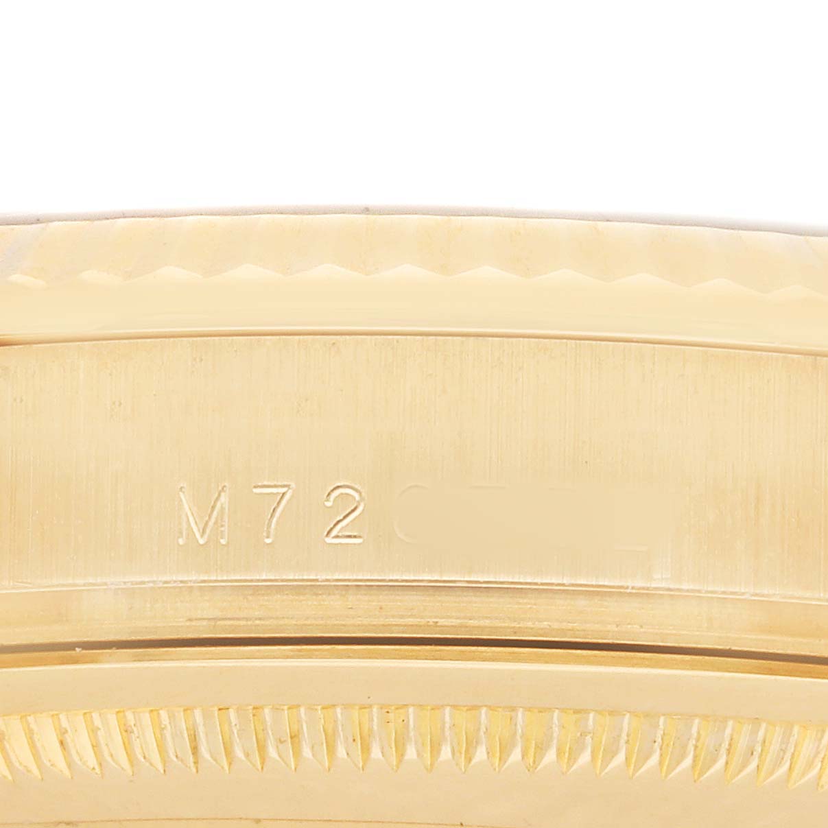 The image shows a close-up of the side of a Rolex President 118238 Men's Yellow Gold Champagne Dial model, focusing on the engraved serial number.