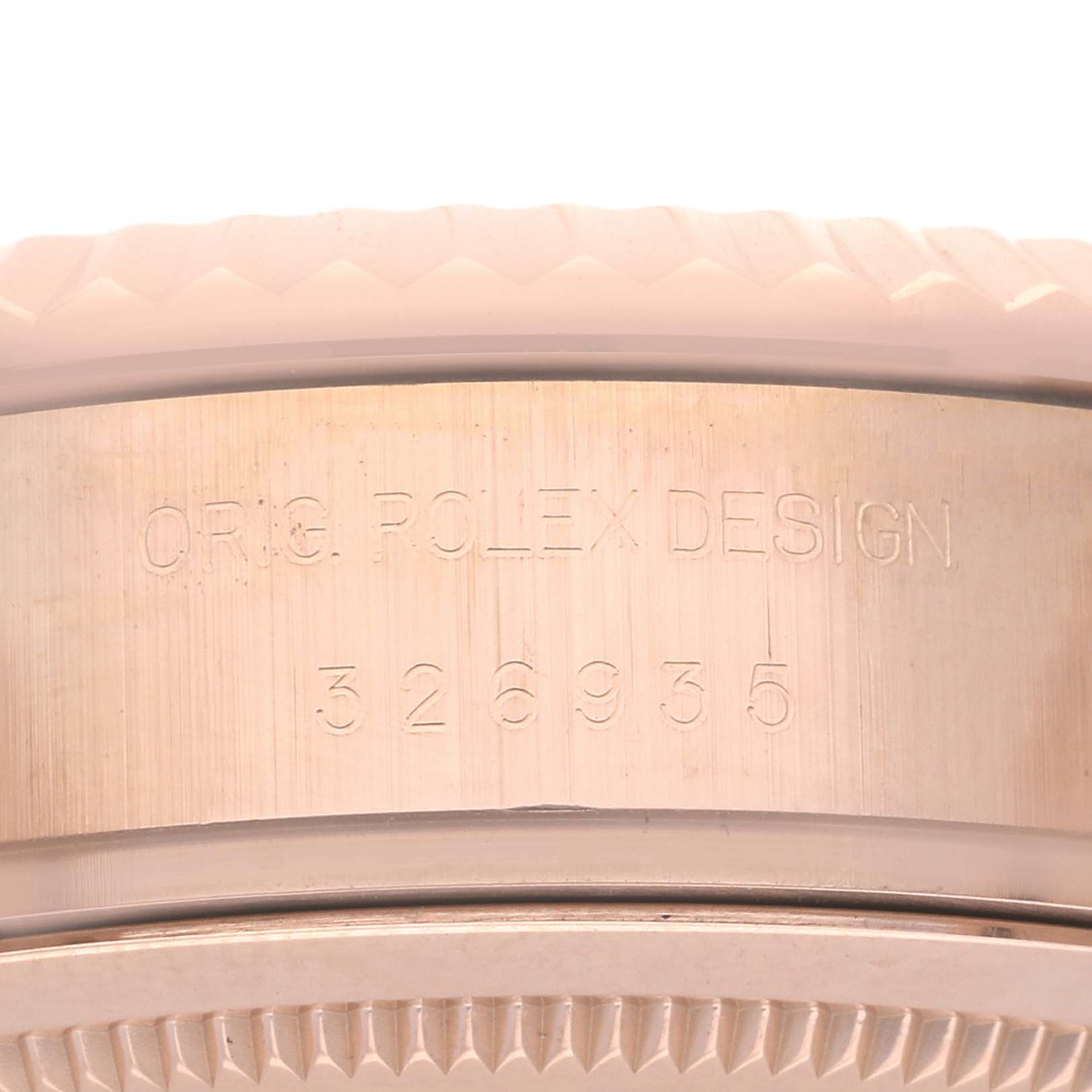 The image shows a close-up of the side of a Rolex Sky-Dweller 326935 Men's Rose Gold Pink Dial 326935 Men's Rose Gold Pink Dial, highlighting the original design and model number engraving.