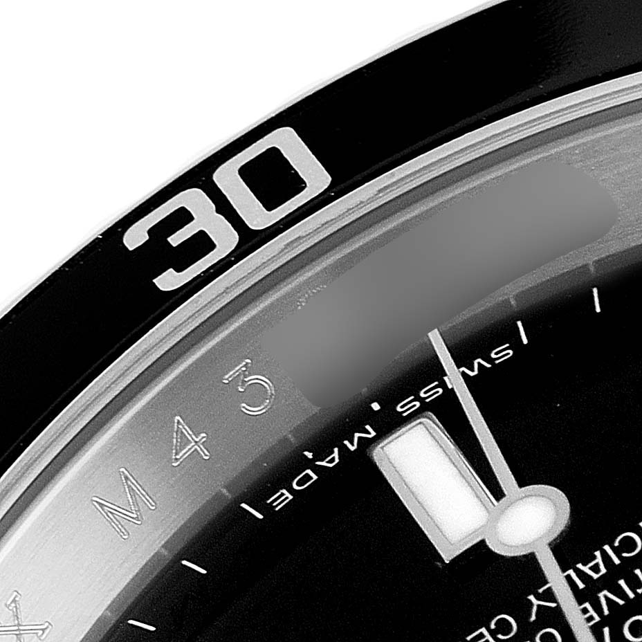 This close-up image of the Rolex Submariner 16610 Men
s Stainless Steel Black Dial 16610 Men
s Stainless Steel Black Dial watch shows part of the bezel with the "30" marker and the dial with minute markers.