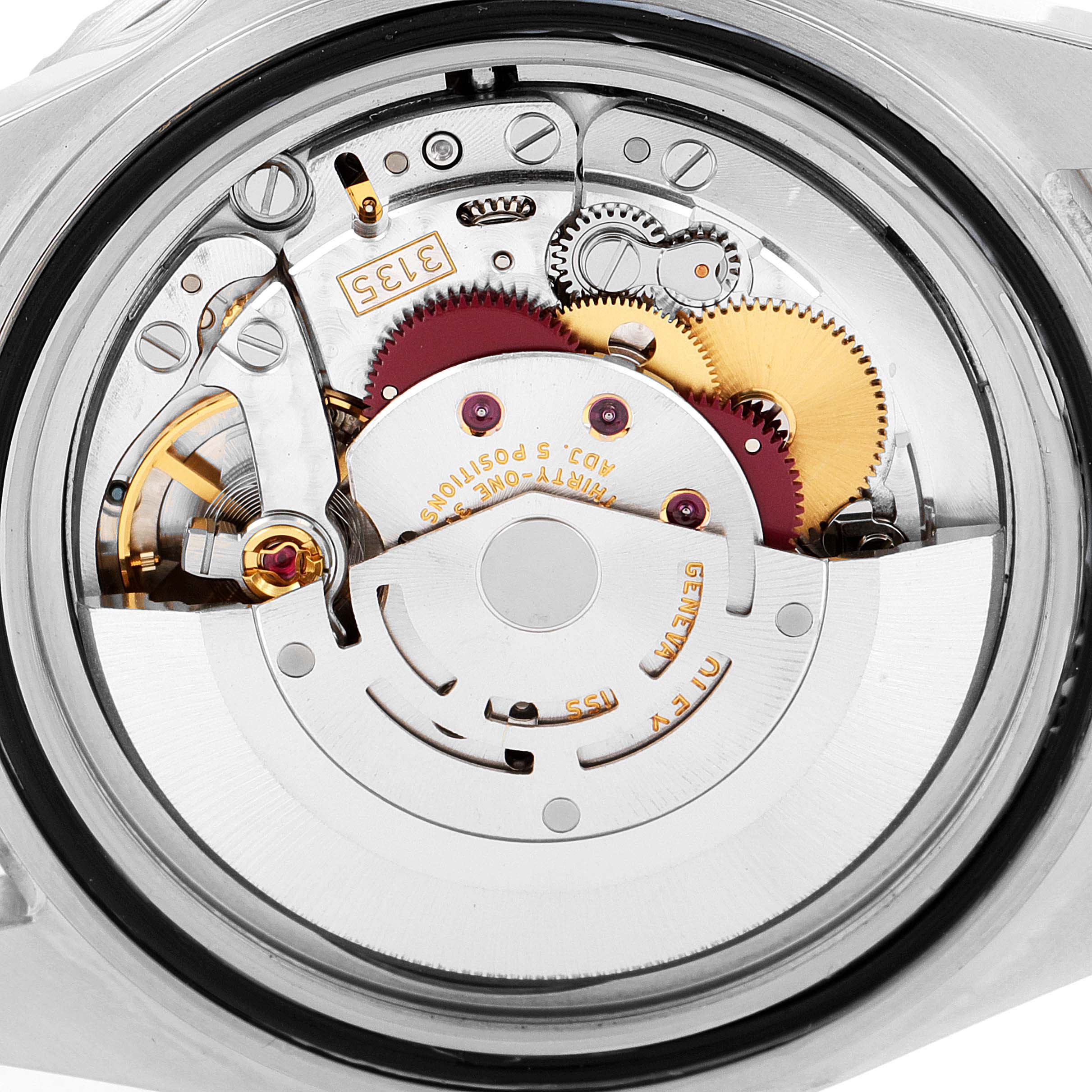 The image shows the internal movement mechanism of a Rolex Submariner 16610 Men
s Stainless Steel Black Dial 16610 Men
s Stainless Steel Black Dial watch from a rear angle.