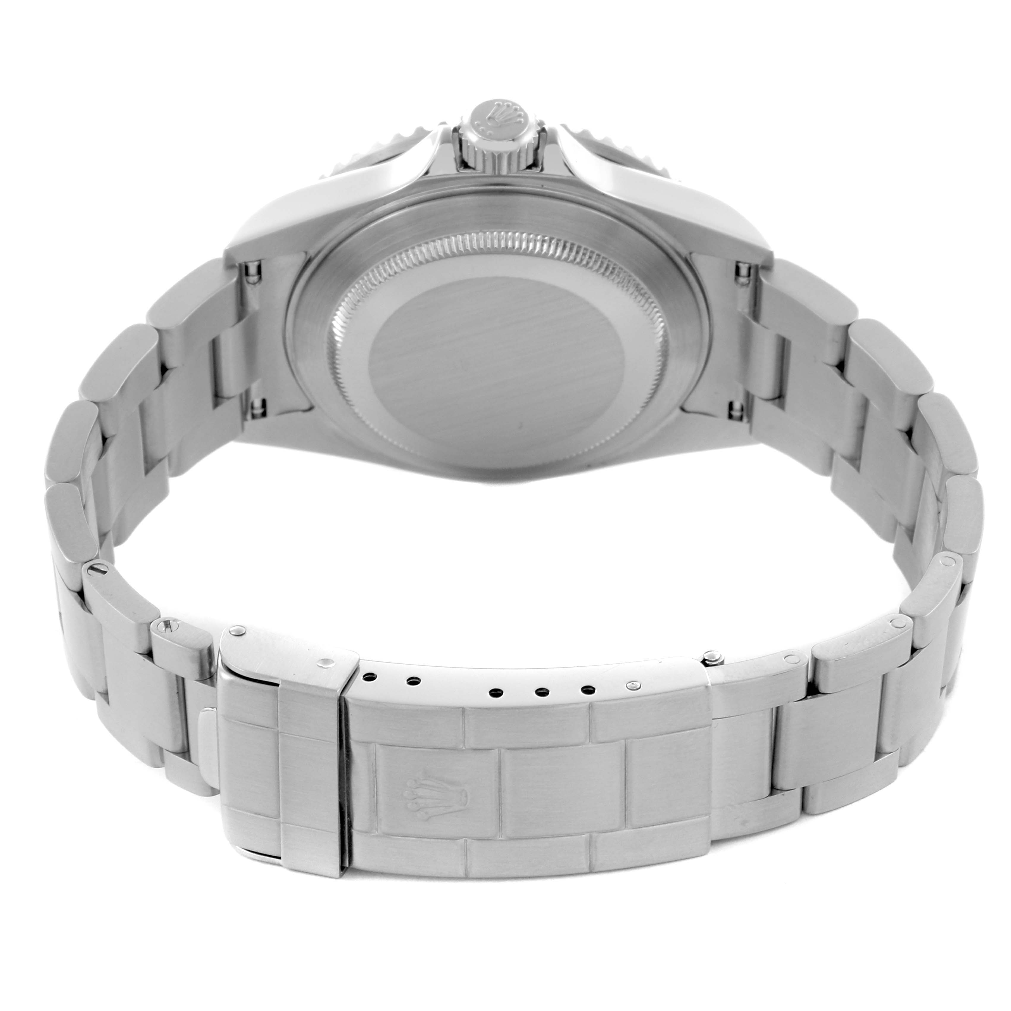 The image shows the back view and bracelet of a Rolex Submariner 16610 Men
s Stainless Steel Black Dial 16610 Men
s Stainless Steel Black Dial, focusing on the case back and clasp.