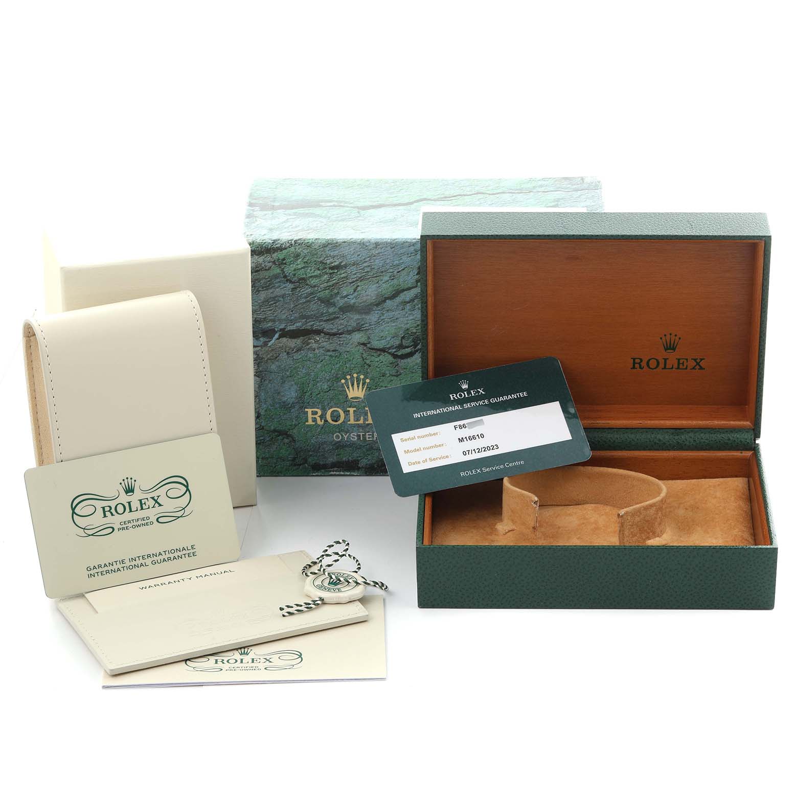 The image shows the accessories for a Rolex Submariner 16610 Men
s Stainless Steel Black Dial 16610 Men
s Stainless Steel Black Dial, including a box, warranty cards, and tags.