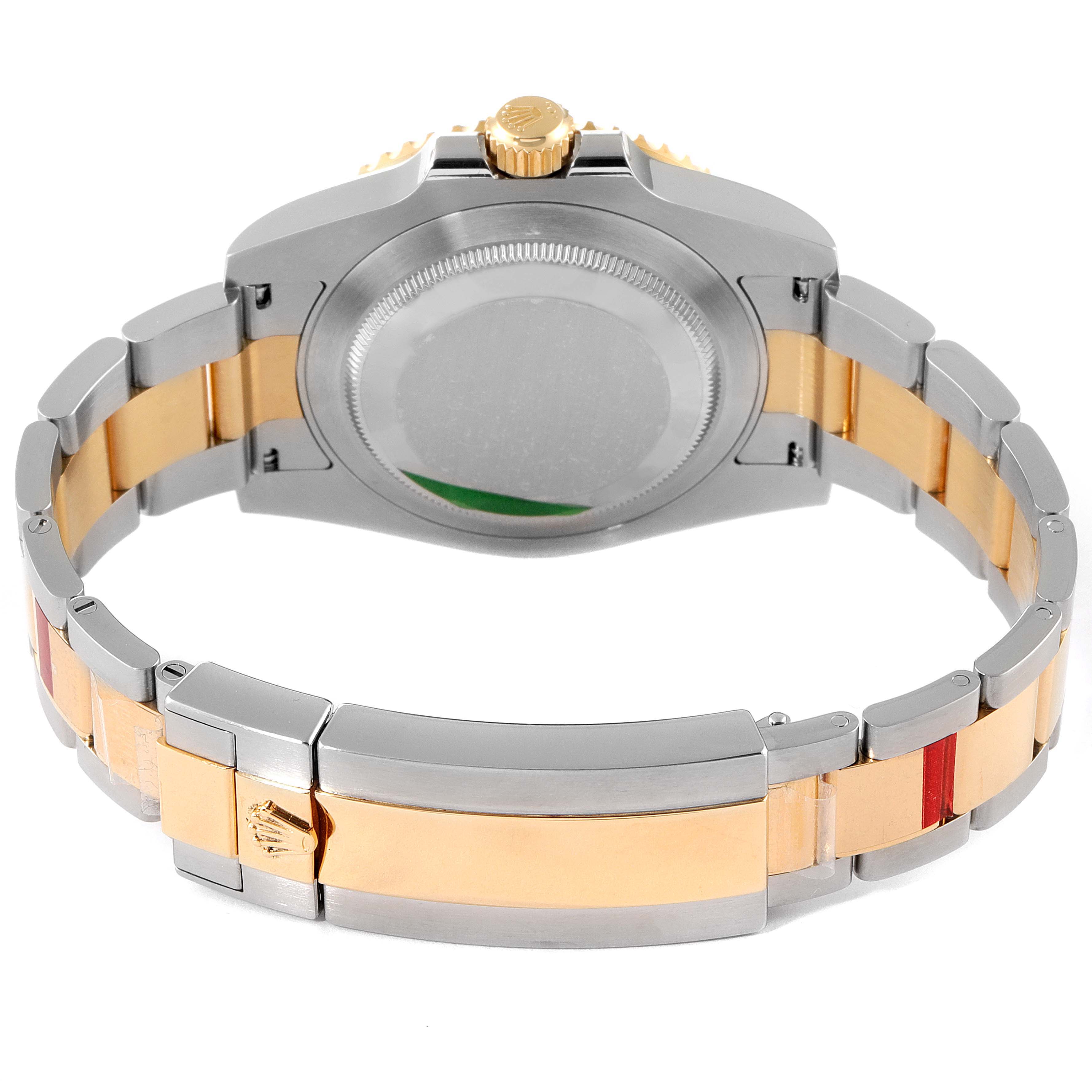 The image shows the back and bracelet of a Rolex Submariner 116613 Men
s Steel and Gold (two tone) Blue Dial 116613 Men
s Steel and Gold (two tone) Blue Dial watch, highlighting its two-tone metal design.