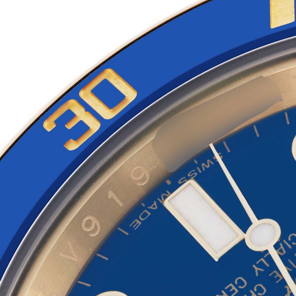 The image shows a close-up of the Rolex Submariner 116618LB Men's Yellow Gold Blue Dial 116618LB Men's Yellow Gold Blue Dial watch, focusing on the blue bezel and part of the dial.