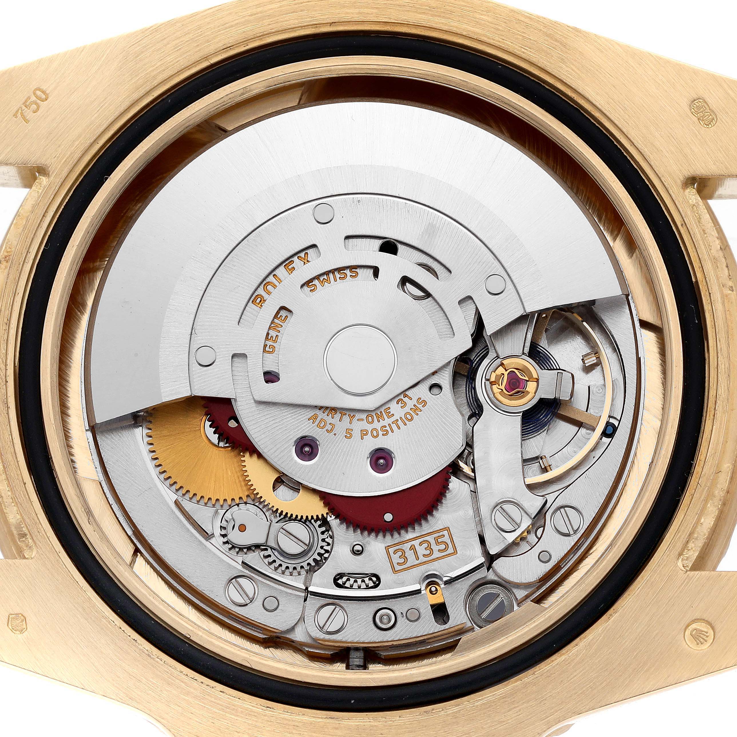 The image shows the detailed inner movement components of a Rolex Submariner 116618LB Men's Yellow Gold Blue Dial 116618LB Men's Yellow Gold Blue Dial watch from a back view angle.