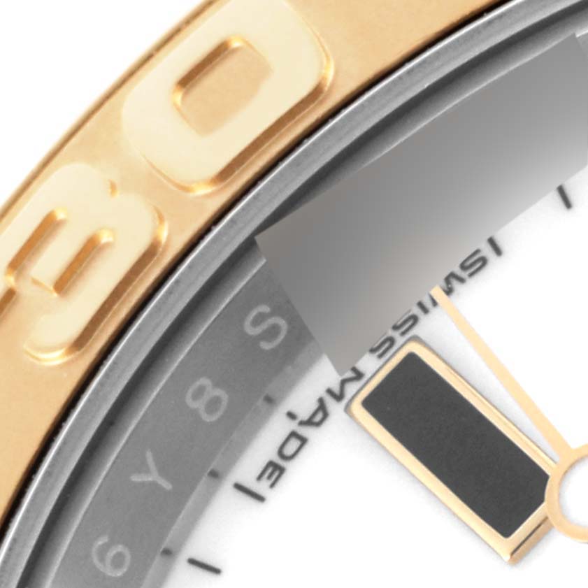 The close-up angle of the Rolex Yacht-Master 16623 Men's Steel and Gold (two tone) White Dial 16623 Men's Steel and Gold (two tone) White Dial shows part of the bezel, dial, and hand elements.