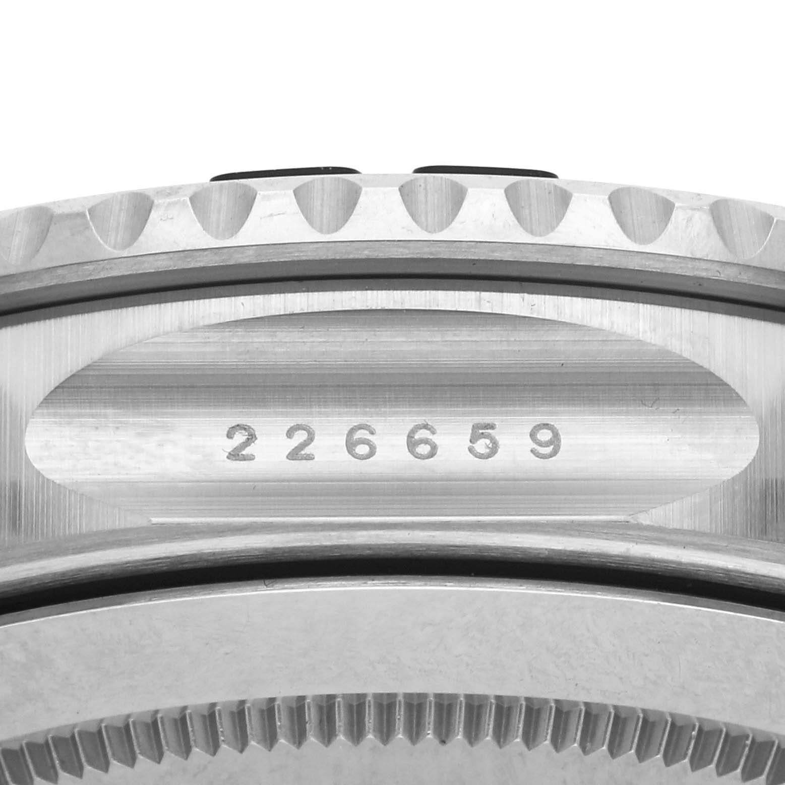The image shows a close-up of the Rolex Yacht-Master 226659 Men's White Gold Black Dial 226659 Men's White Gold Black Dial's bezel and serial number engraving.
