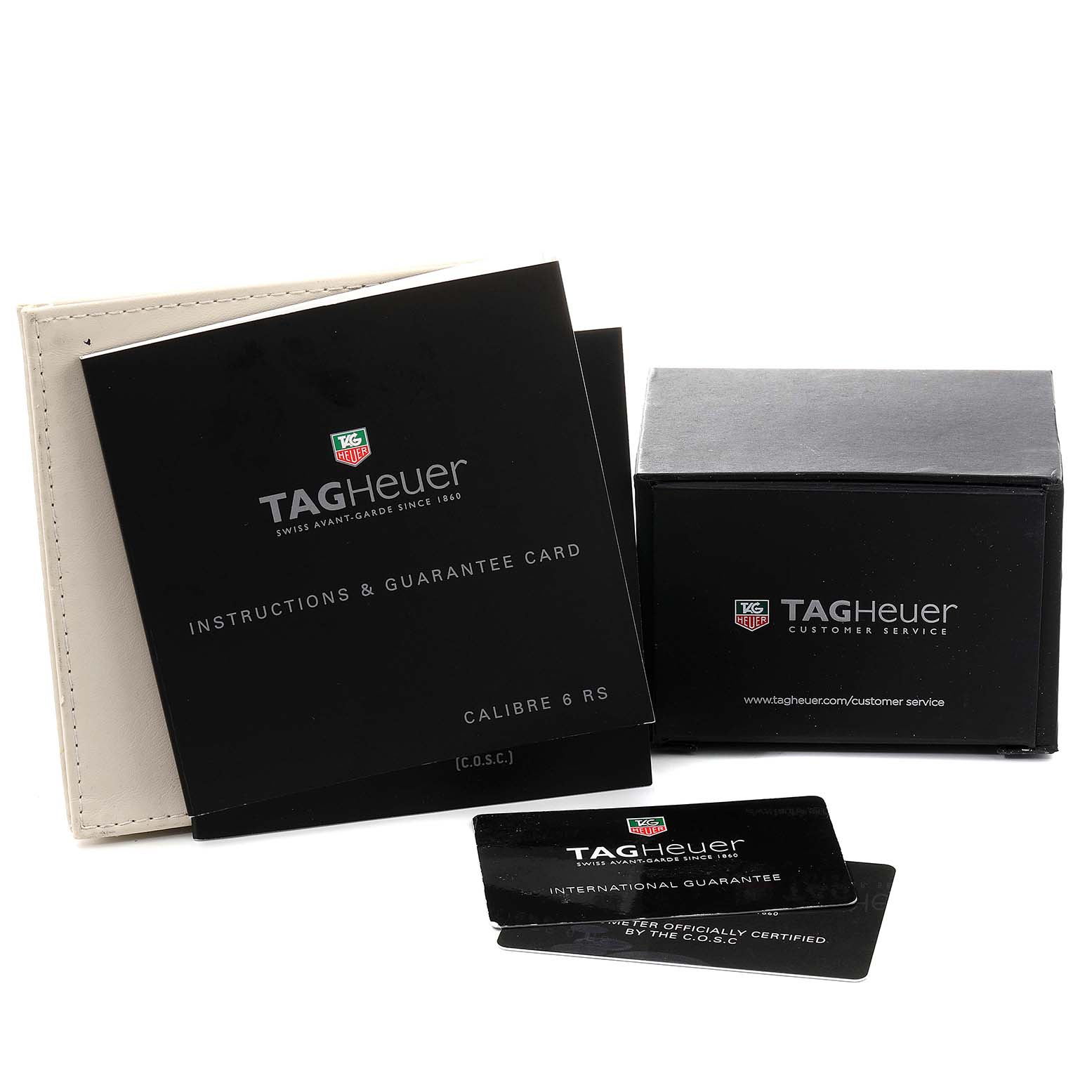 This image shows the user manual, guarantee card, and box of a Tag Heuer Carrera WAV511C.FC6230 Men's Stainless Steel Brown Dial WAV511C.FC6230 Men's Stainless Steel Brown Dial watch, angled from above.