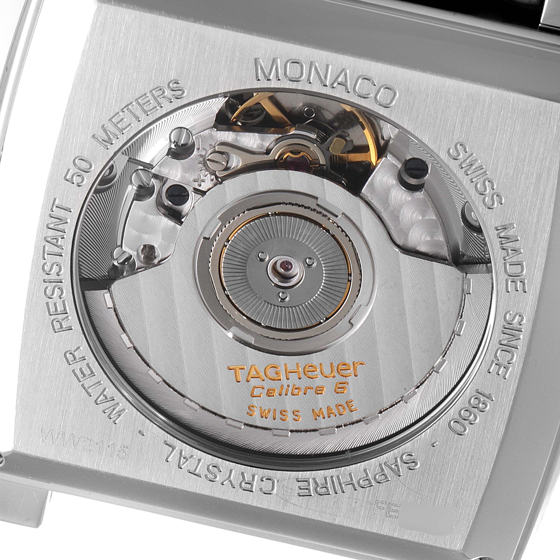 The image shows the back of a Tag Heuer Monaco WW2115.FC6217 Men's Stainless Steel Brown Dial WW2115.FC6217 Men's Stainless Steel Brown Dial watch, highlighting the Calibre 6 movement and inscriptions around the case.