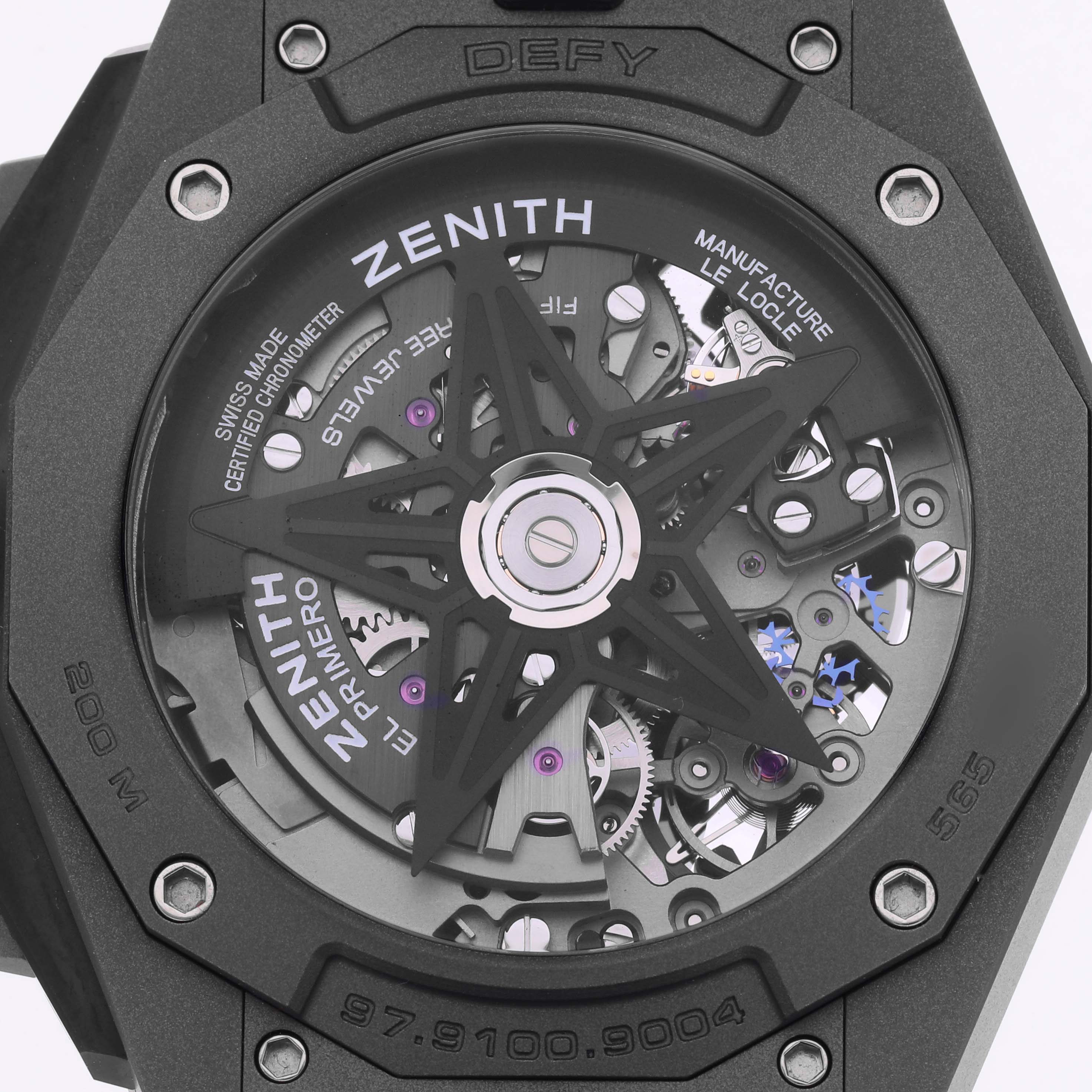 The image shows the back of the Zenith Defy 97.9100.9004/02.I001 Men's Titanium Grey Dial watch, highlighting its open movement and intricate inner mechanisms.