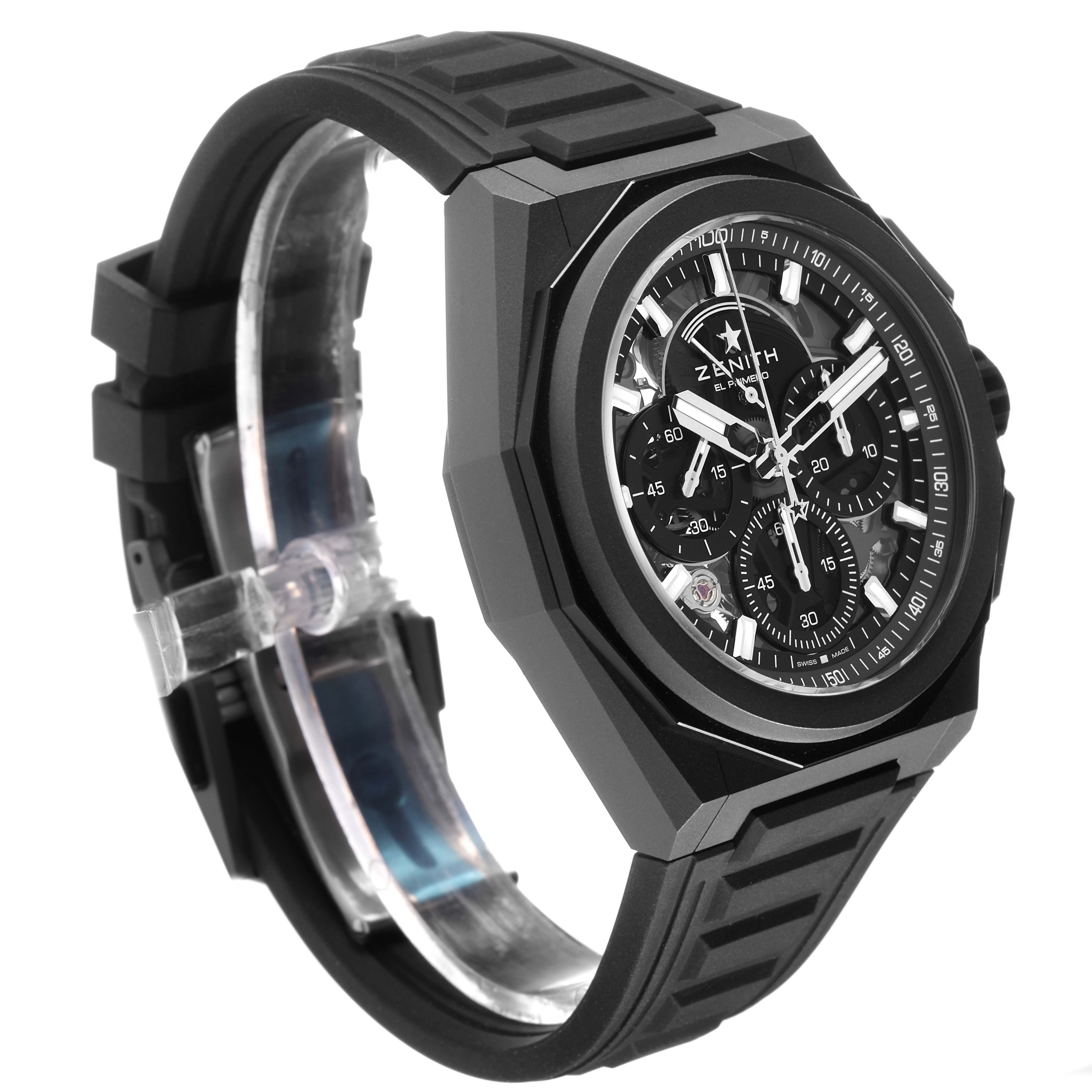 The Zenith Defy 97.9100.9004/02.I001 Men's Titanium Grey Dial watch is shown from a side angle, displaying the case, dial, band, and chronograph subdials.