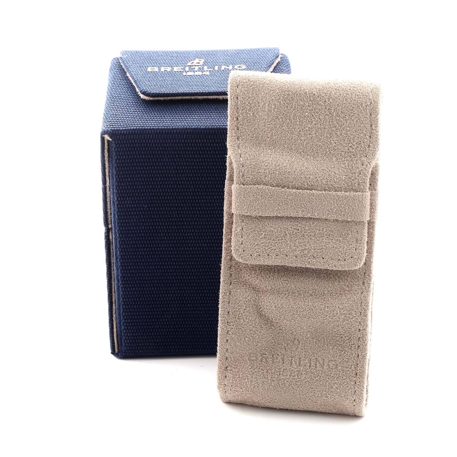 The image shows a Breitling Chronomat AB0134101C1A1 Men's Stainless Steel Blue Dial watch's packaging, featuring a blue box and a beige suede pouch.