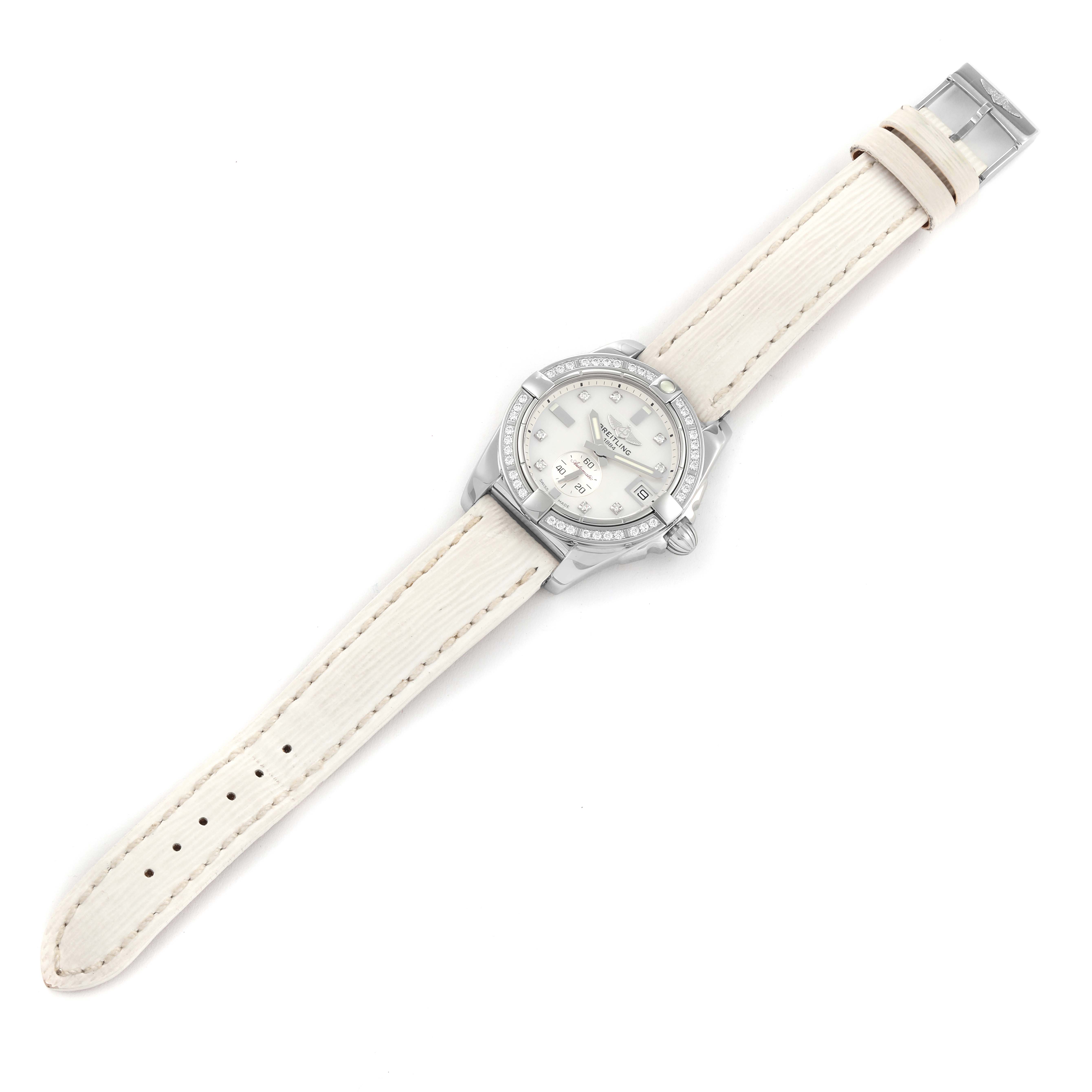 This image shows a top-down view of a Breitling Galactic A3733053/A717 Men's Stainless Steel Mother of Pearl Dial A3733053/A717 Men's Stainless Steel Mother of Pearl Dial watch featuring a white leather strap and a silver bezel.