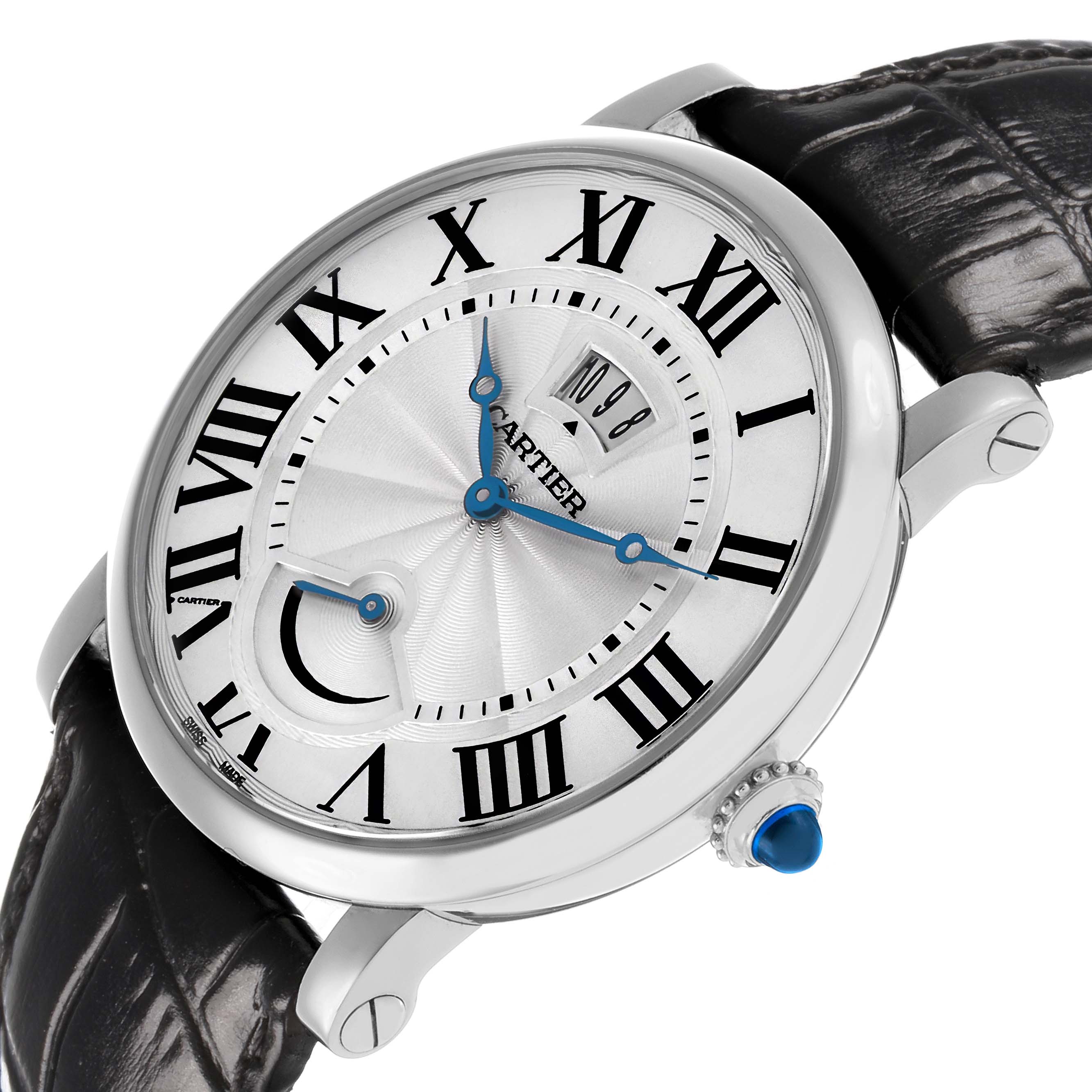 The Cartier Rotonde W1556369 Men's Stainless Steel Silver Dial watch is shown at a tilted angle, highlighting the dial, Roman numerals, blued hands, and crown with a blue cabochon.