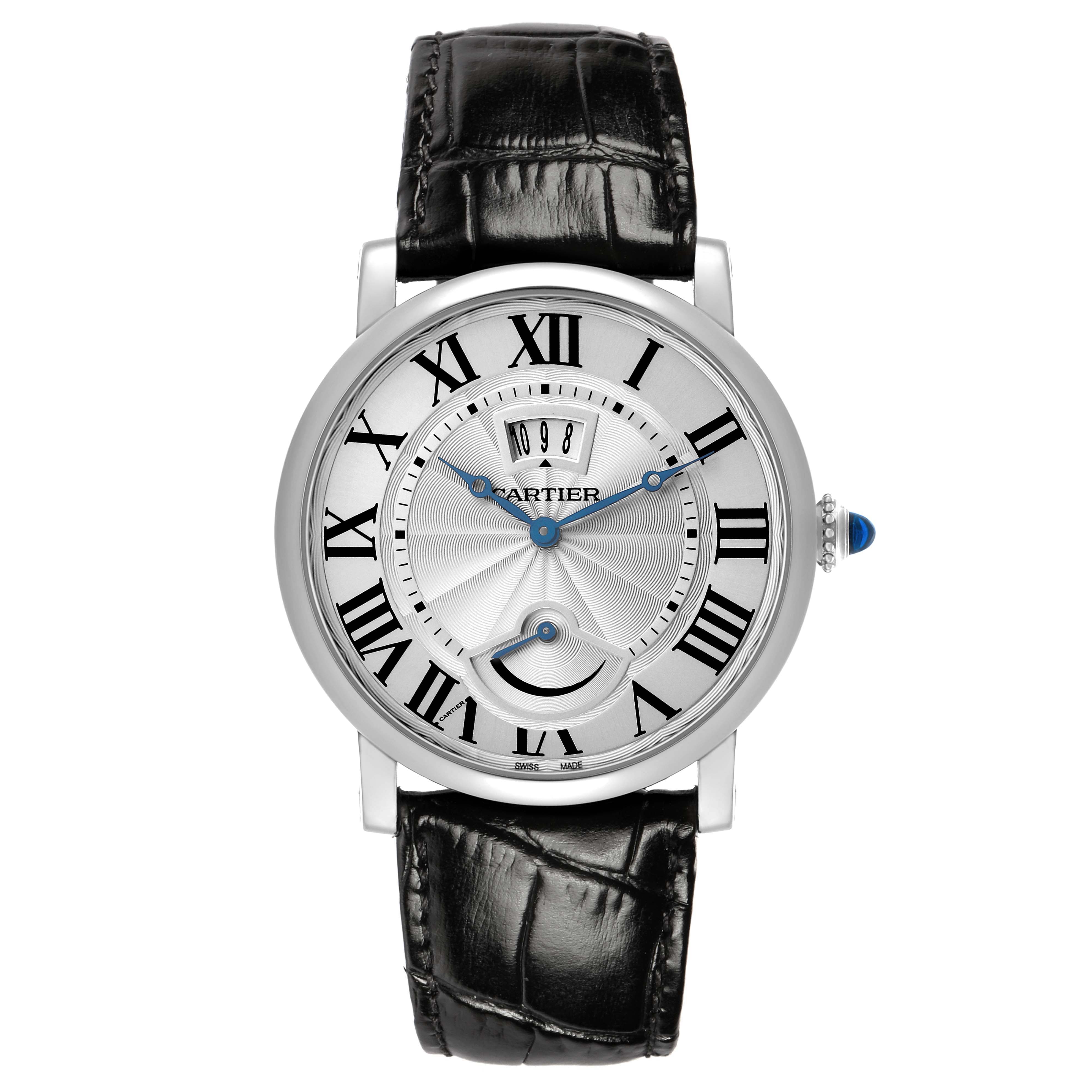 The Cartier Rotonde W1556369 Men's Stainless Steel Silver Dial watch is shown from a front angle, highlighting its dial, Roman numerals, blue hands, and leather strap.