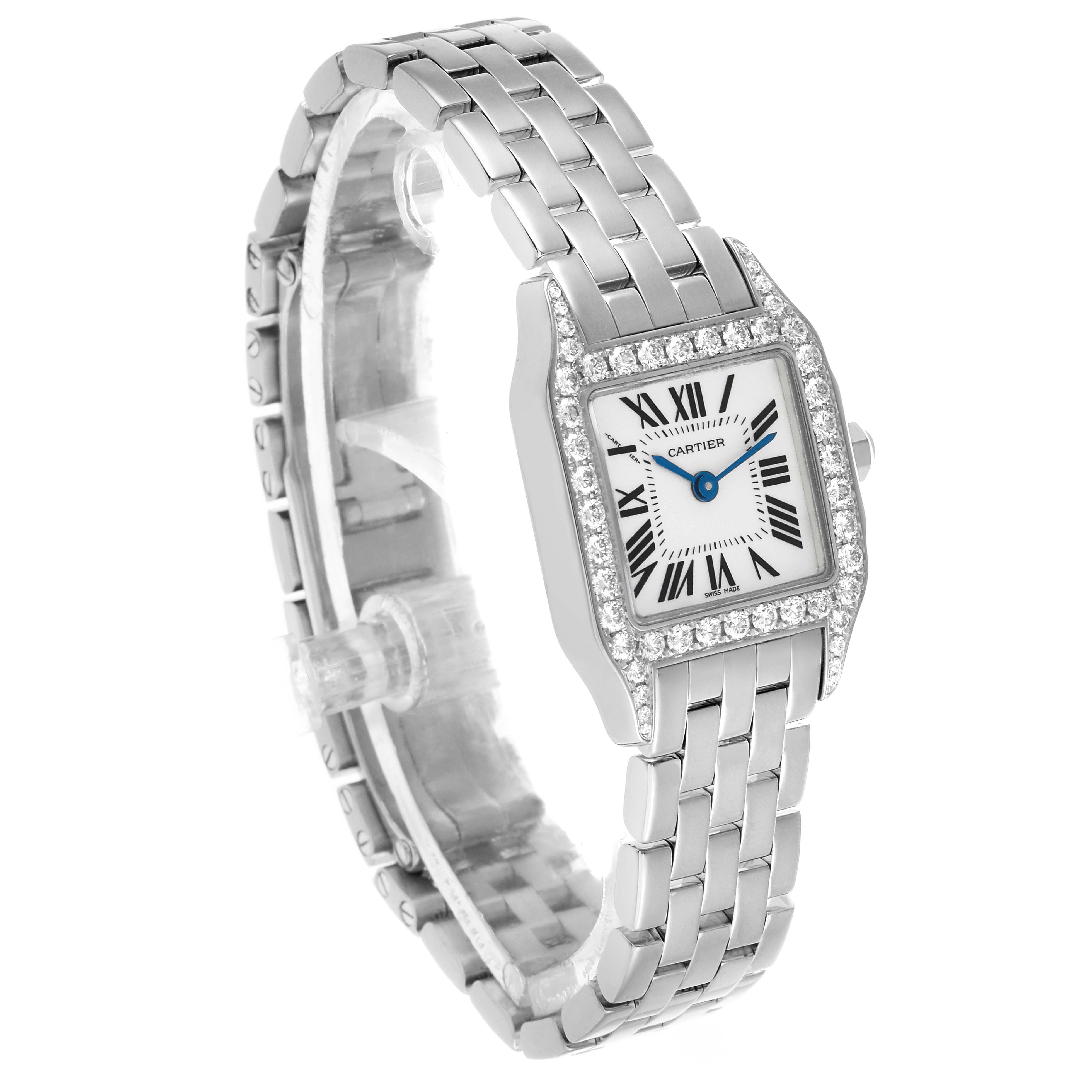 The Cartier Santos Demoiselle WF9005Y8 Women's White Gold Silver Dial watch is shown angled slightly left, displaying its face, diamond bezel, and silver bracelet.
