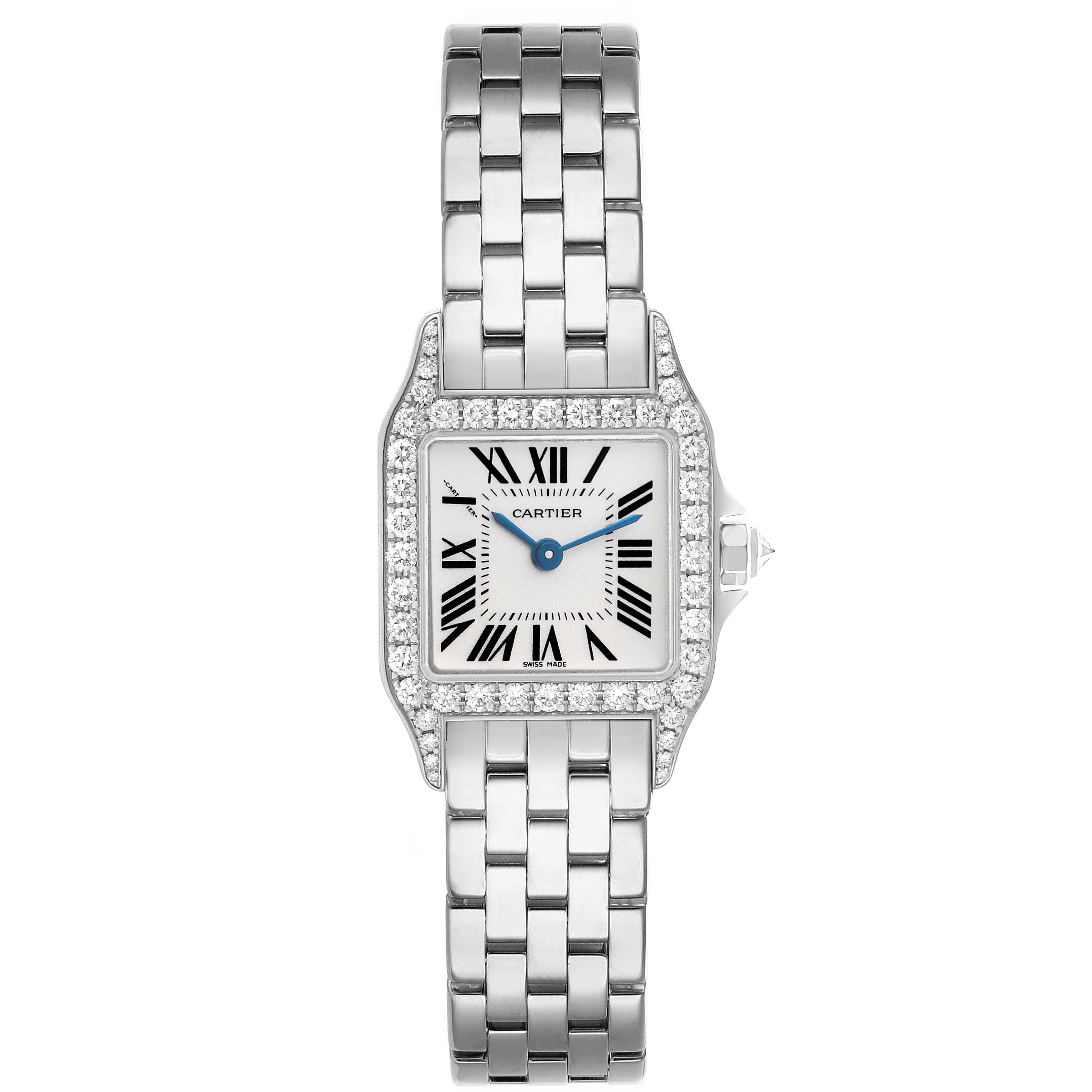 The Cartier Santos Demoiselle WF9005Y8 Women's White Gold Silver Dial watch is shown front-facing, highlighting its square face, Roman numerals, and metal bracelet.