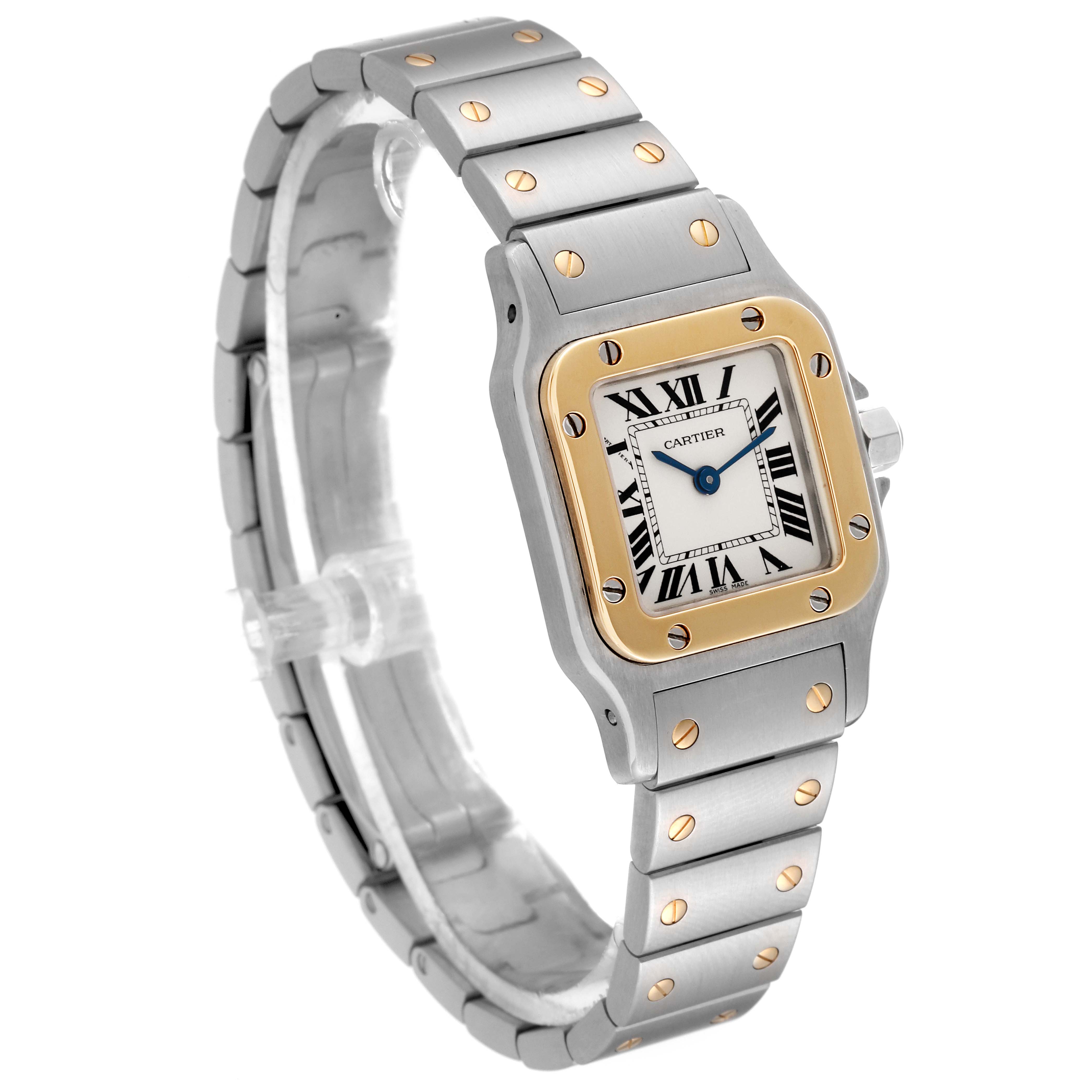 This image shows a Santos de Cartier watch from an angled side view, highlighting its square face, bezel, and metal bracelet.