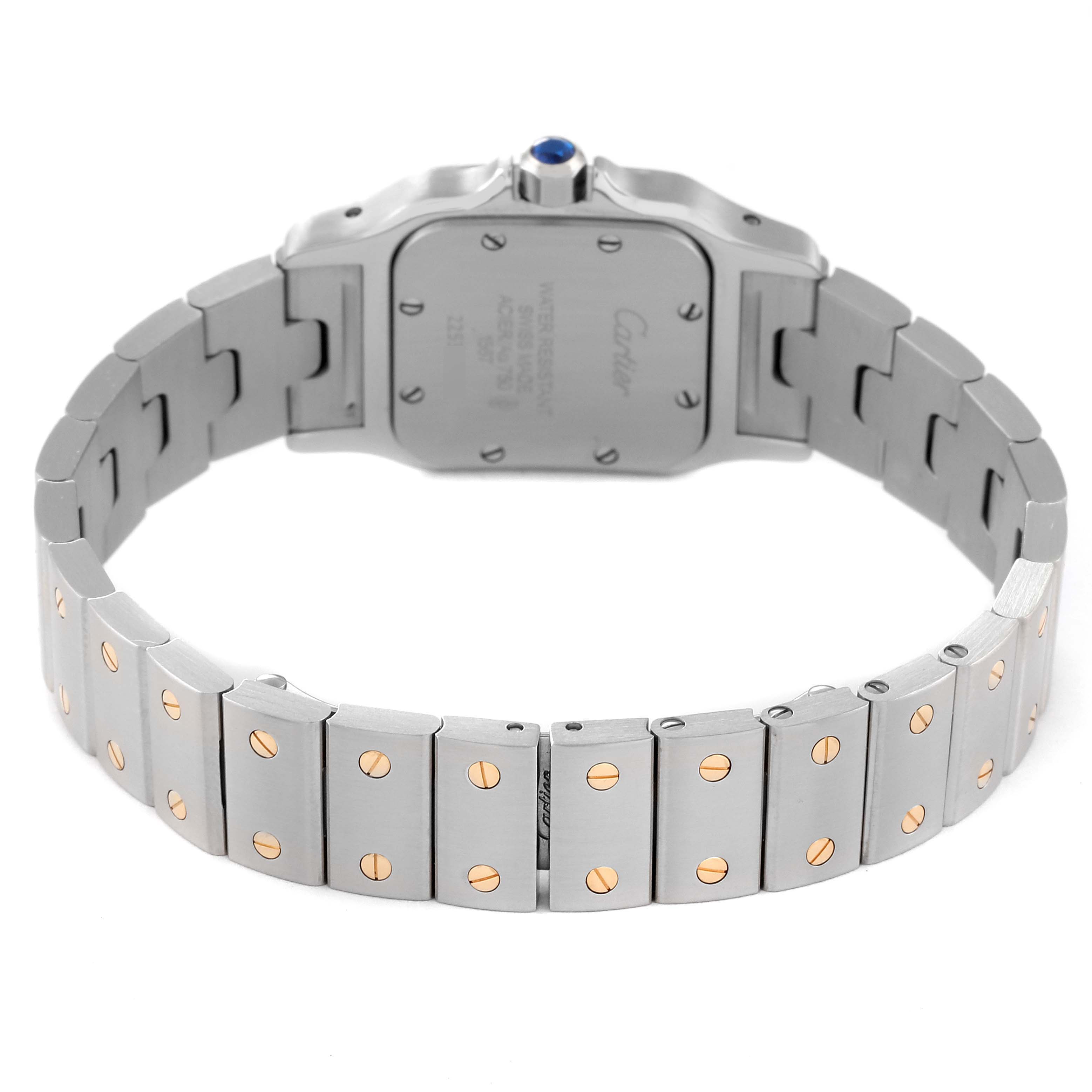 The image shows the back of the Santos model watch by Cartier, highlighting the case back and metal bracelet with screws.