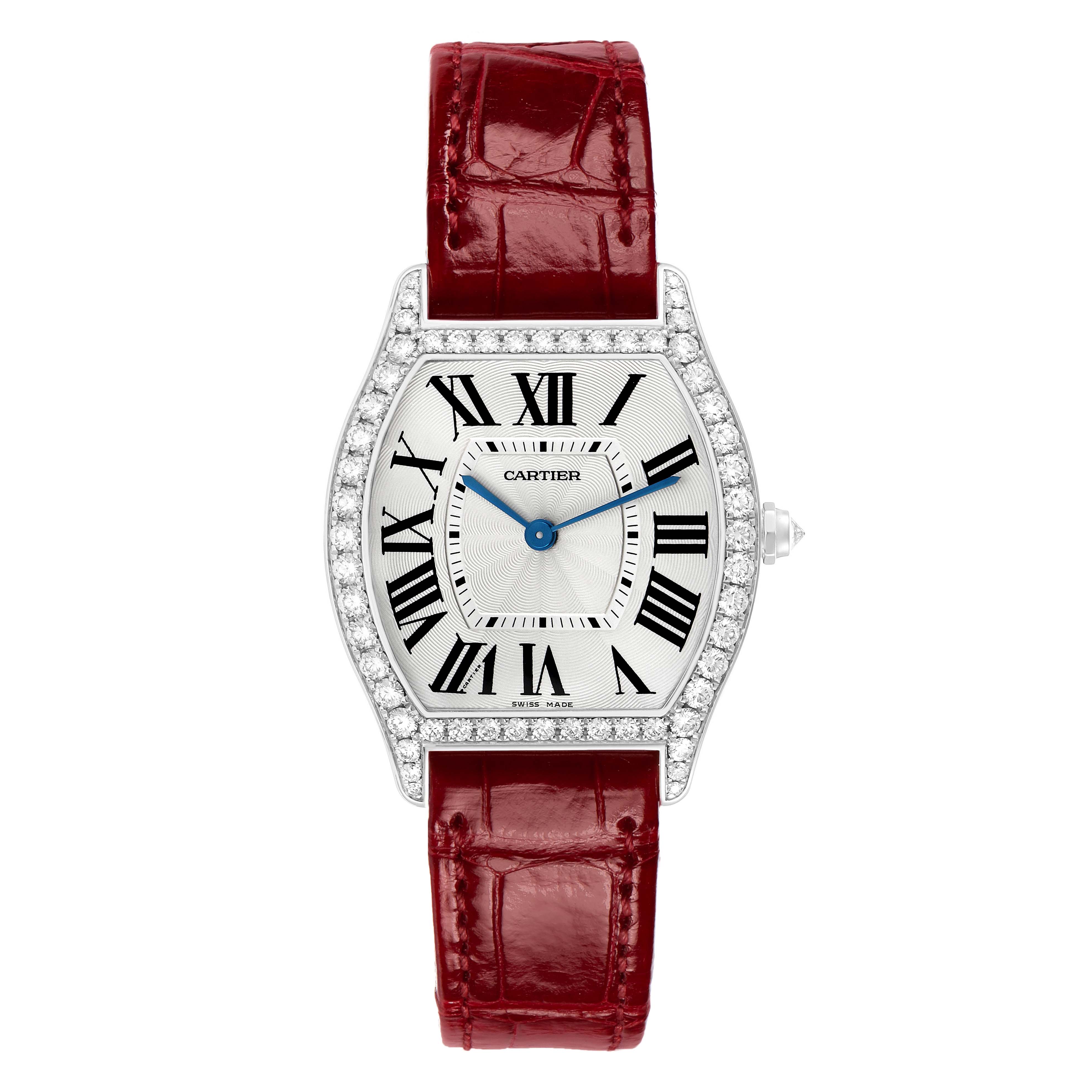 The Cartier Tortue WA501009 Women's White Gold Silver Dial watch is shown from a top-down angle, highlighting its face, strap, and diamond-set case.