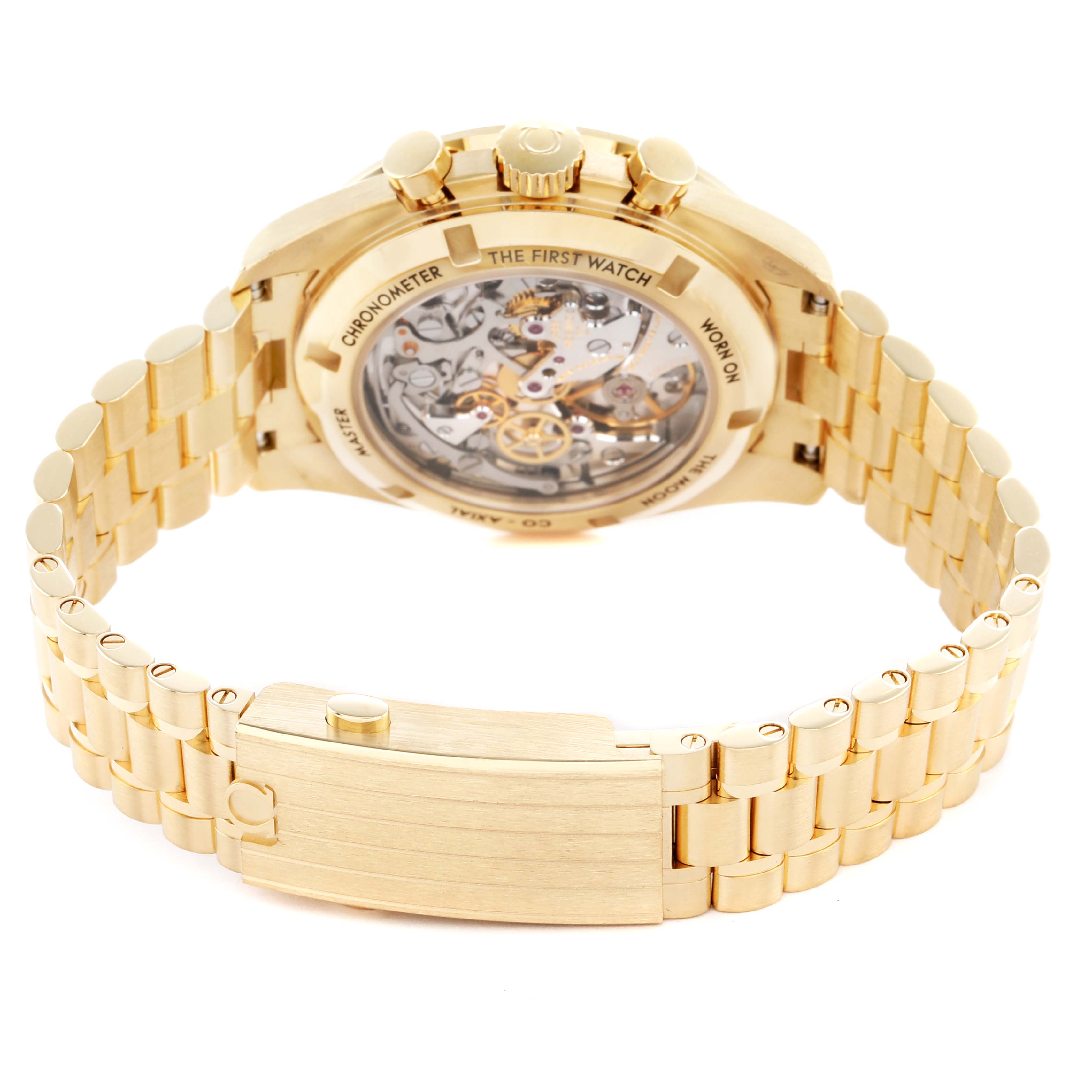 The Omega Speedmaster 310.62.42.50.99.001 Men's Yellow Gold Champagne Dial model is shown from the back, highlighting its transparent caseback and gold bracelet clasp.