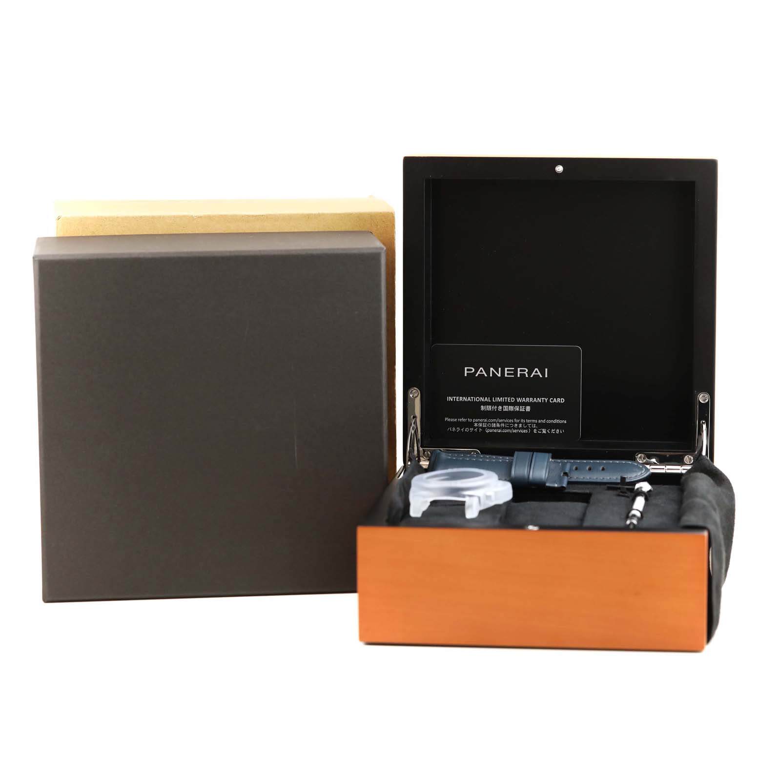 The image shows a Panerai Submersible PAM01232 Men
s Titanium Blue Dial PAM01232 Men
s Titanium Blue Dial watch box with additional accessories, including straps and tools, viewed from the front.