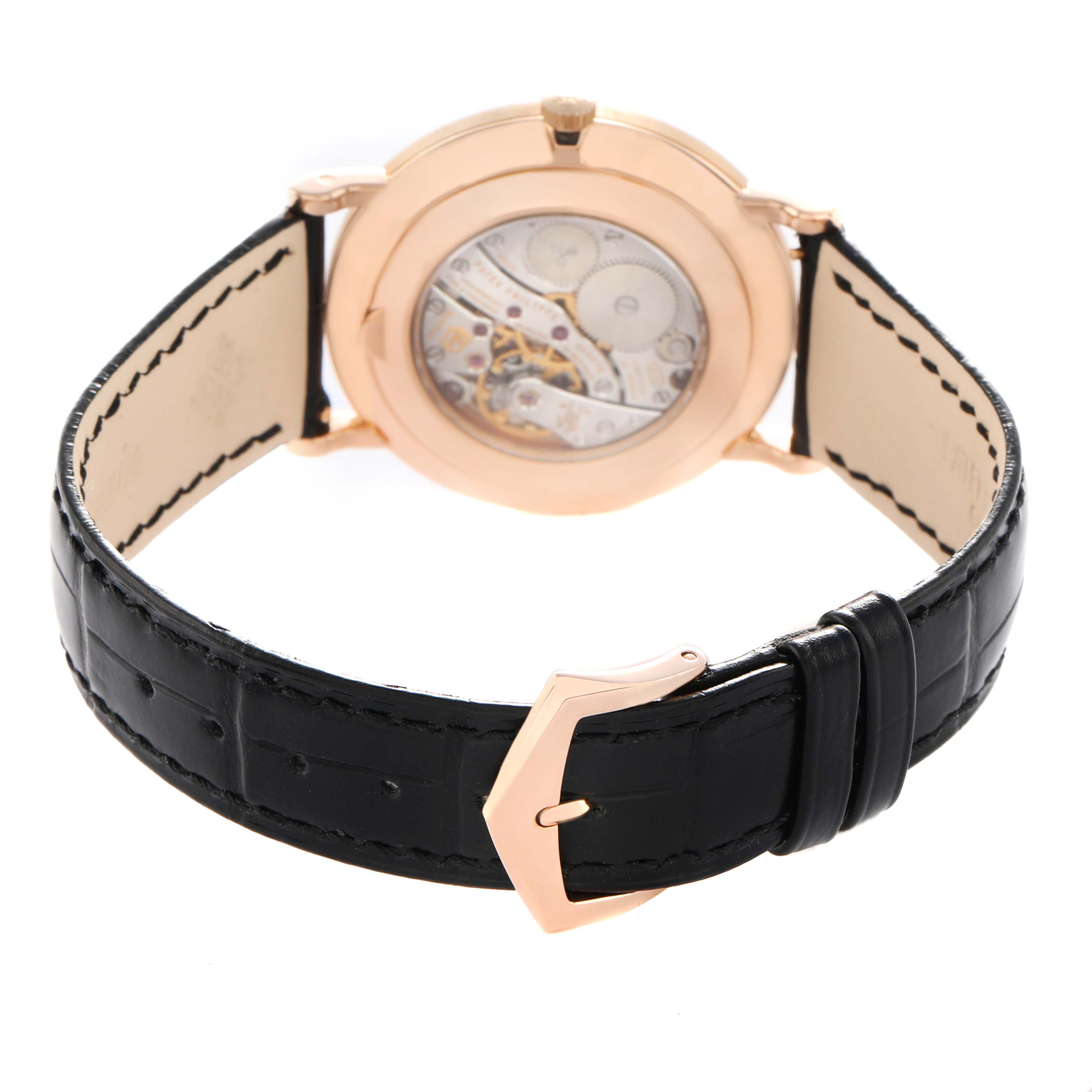 The image shows the back angle of the Patek Philippe Calatrava 5119R-001 Men's Rose Gold White Dial, highlighting the movement and black leather strap.