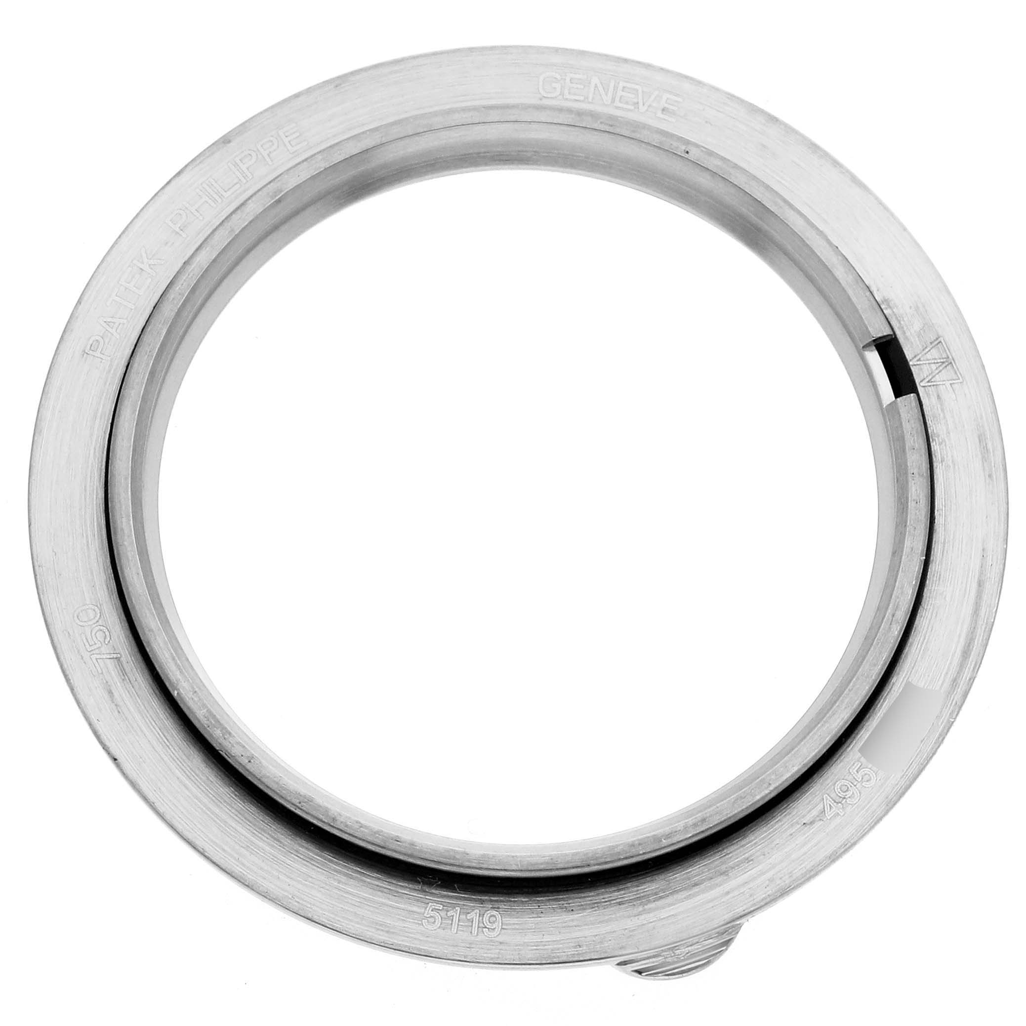 This image shows the front angle of a bezel for a Patek Philippe Calatrava 5119G-001 Men's White Gold White Dial, highlighting the engraved details.