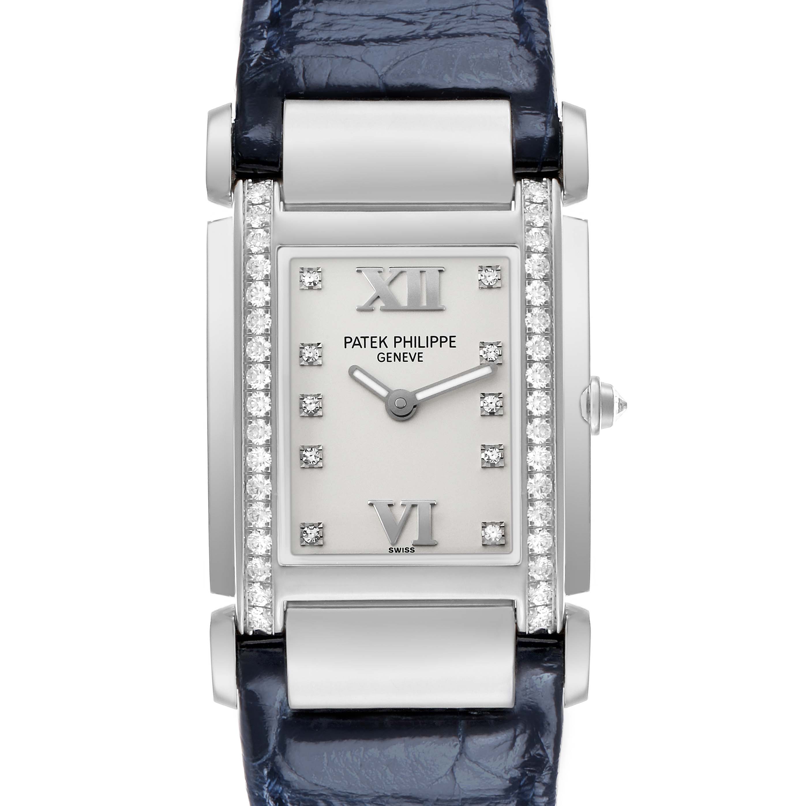 The Patek Philippe Twenty-4 4920G-010 Women's White Gold Silver Dial watch is shown from a front view, displaying its rectangular face, diamond markers, and leather strap.