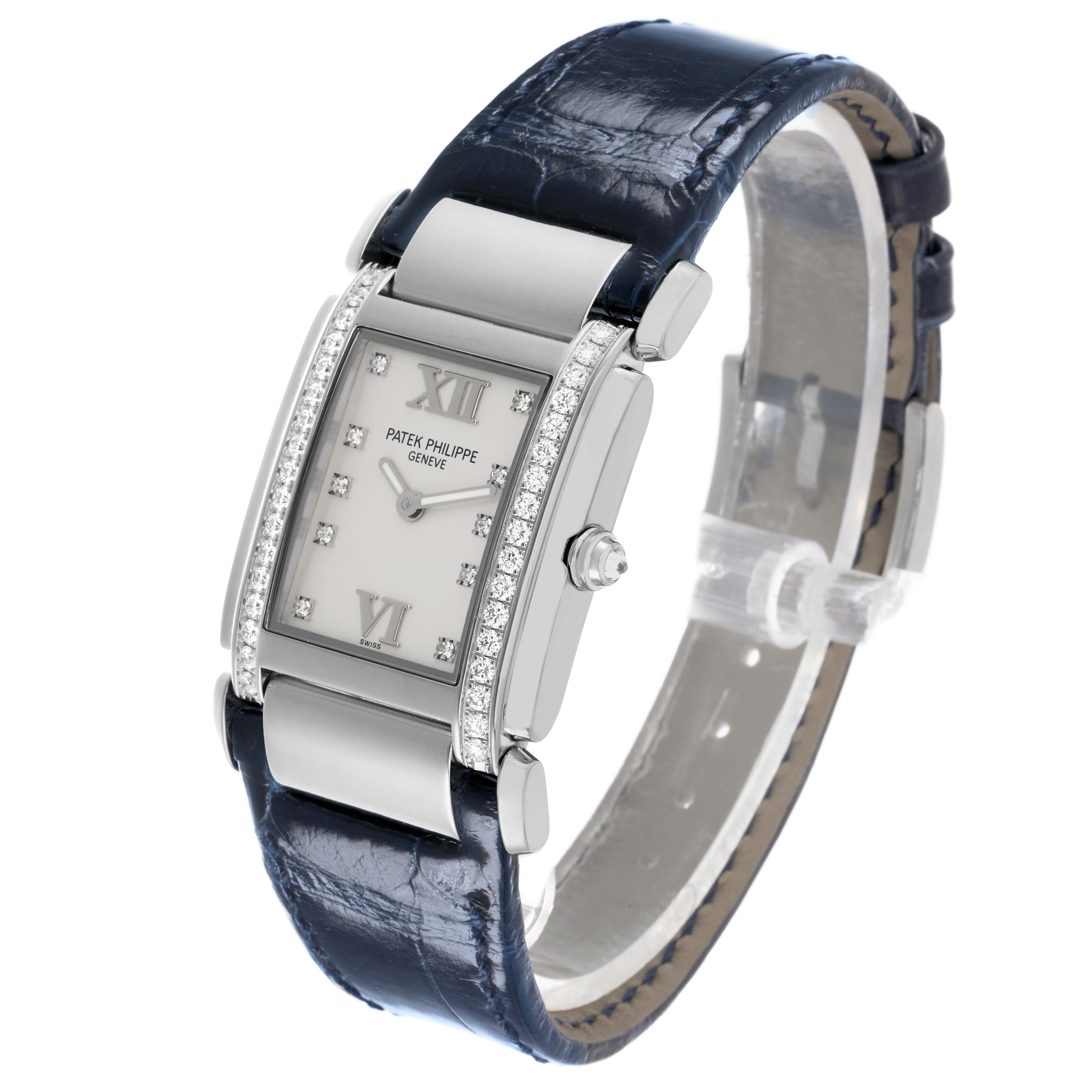 The Patek Philippe Twenty-4 4920G-010 Women's White Gold Silver Dial watch is shown at an angle displaying its rectangular face, diamond accents, and leather strap.