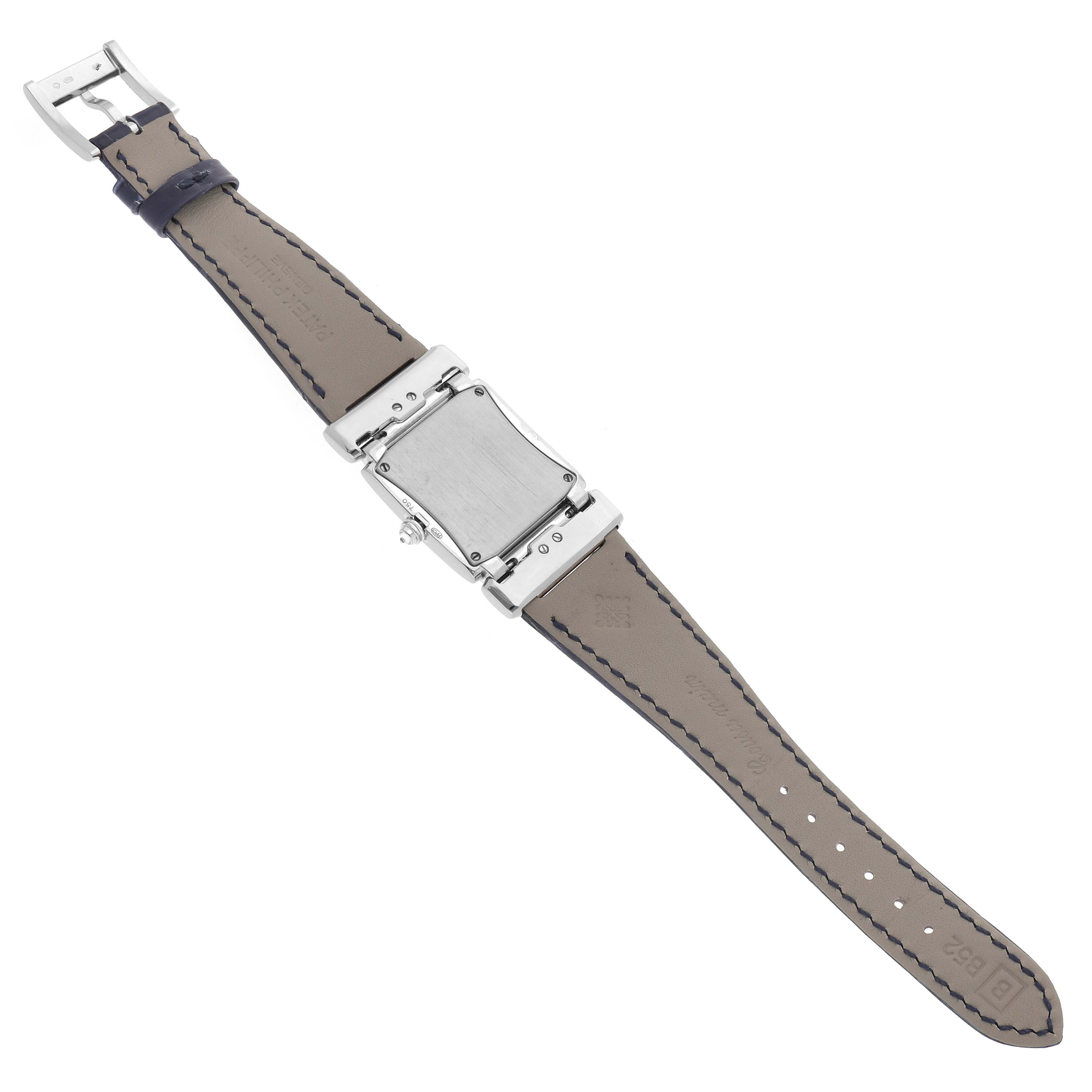 The image shows the back view of a Patek Philippe Twenty-4 4920G-010 Women's White Gold Silver Dial watch, highlighting the case back, buckle, and leather strap.