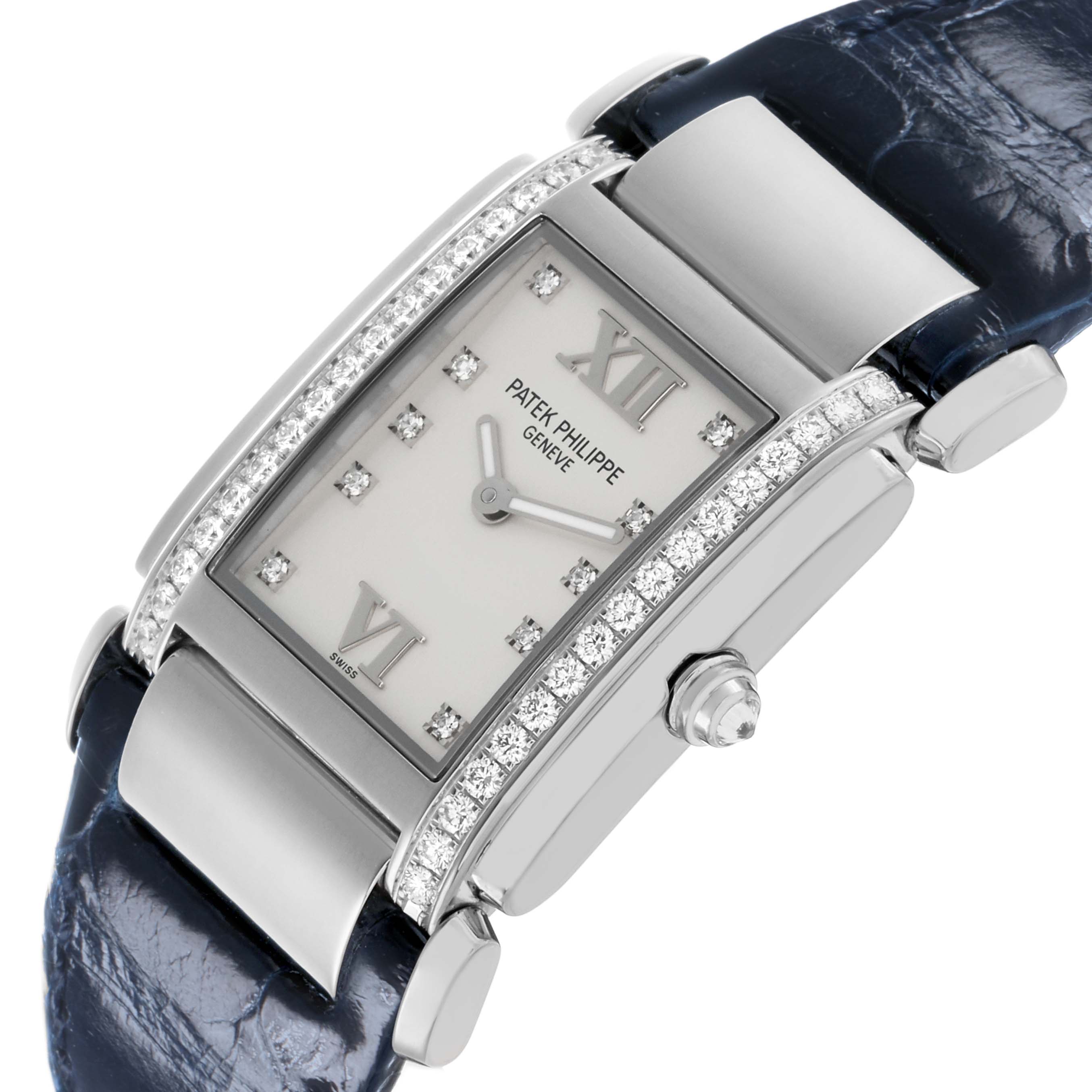 The Patek Philippe Twenty-4 4920G-010 Women's White Gold Silver Dial watch is shown from a top-side angle, highlighting its rectangular face, diamond-studded bezel, crown, and a portion of the strap.
