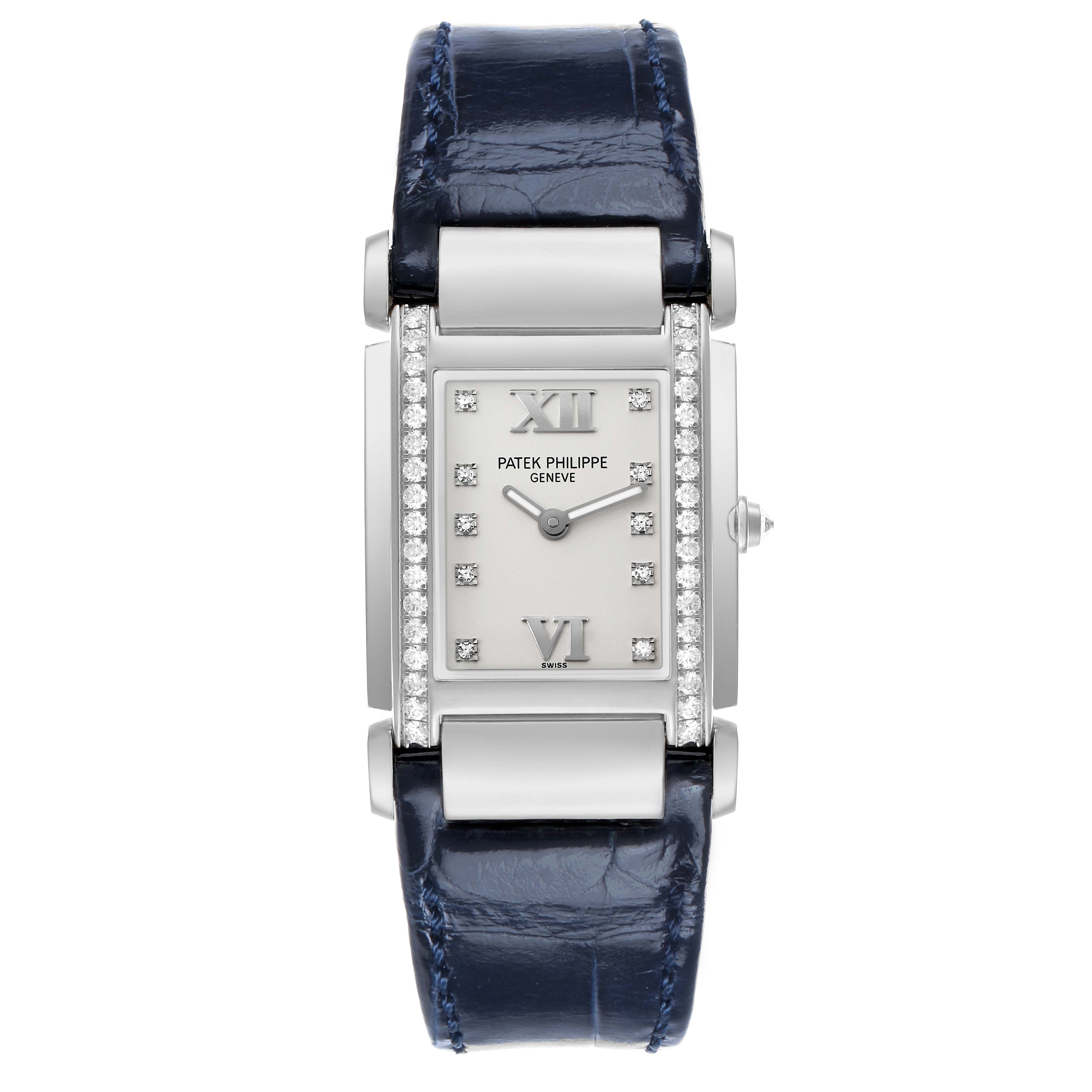 The image shows a Patek Philippe Twenty-4 4920G-010 Women's White Gold Silver Dial watch from a front angle, highlighting the face, diamonds, and blue strap.
